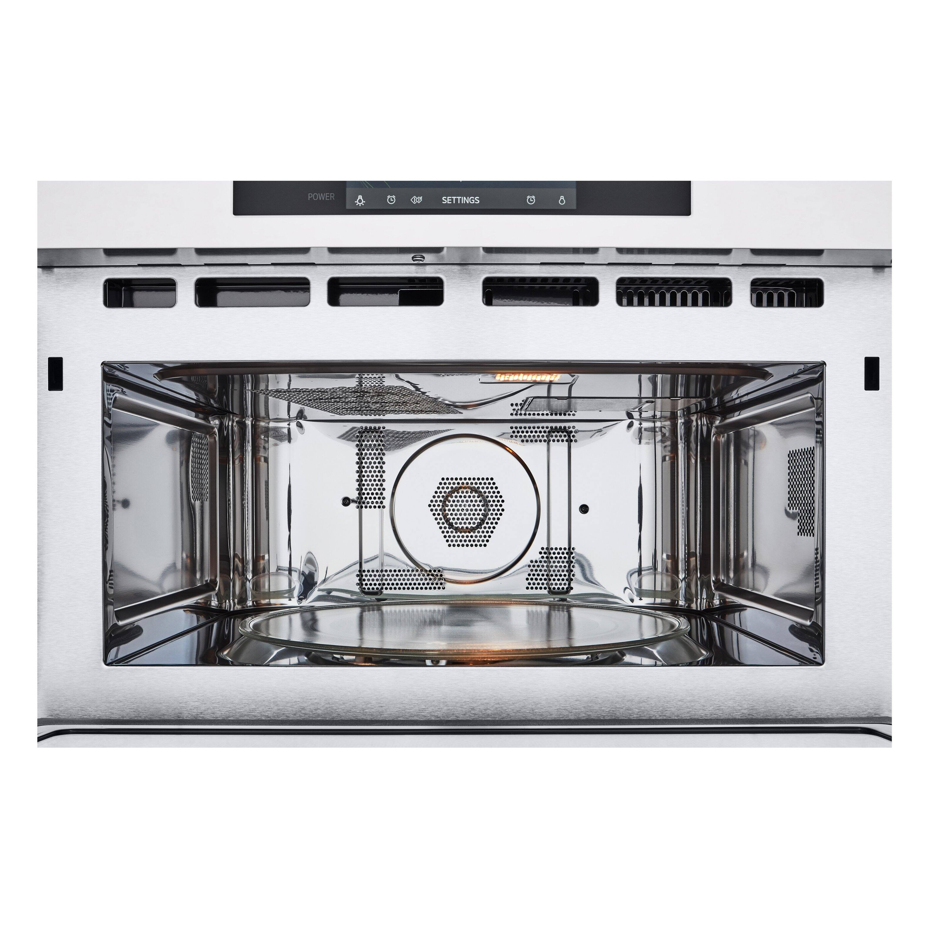 The image shows a stainless steel oven with a glass door. The oven has a digital display on the front, which indicates that it is a modern appliance. The display shows the power settings, which allows users to adjust the power according to their needs. The oven is empty, and the door is open, revealing the interior of the appliance.