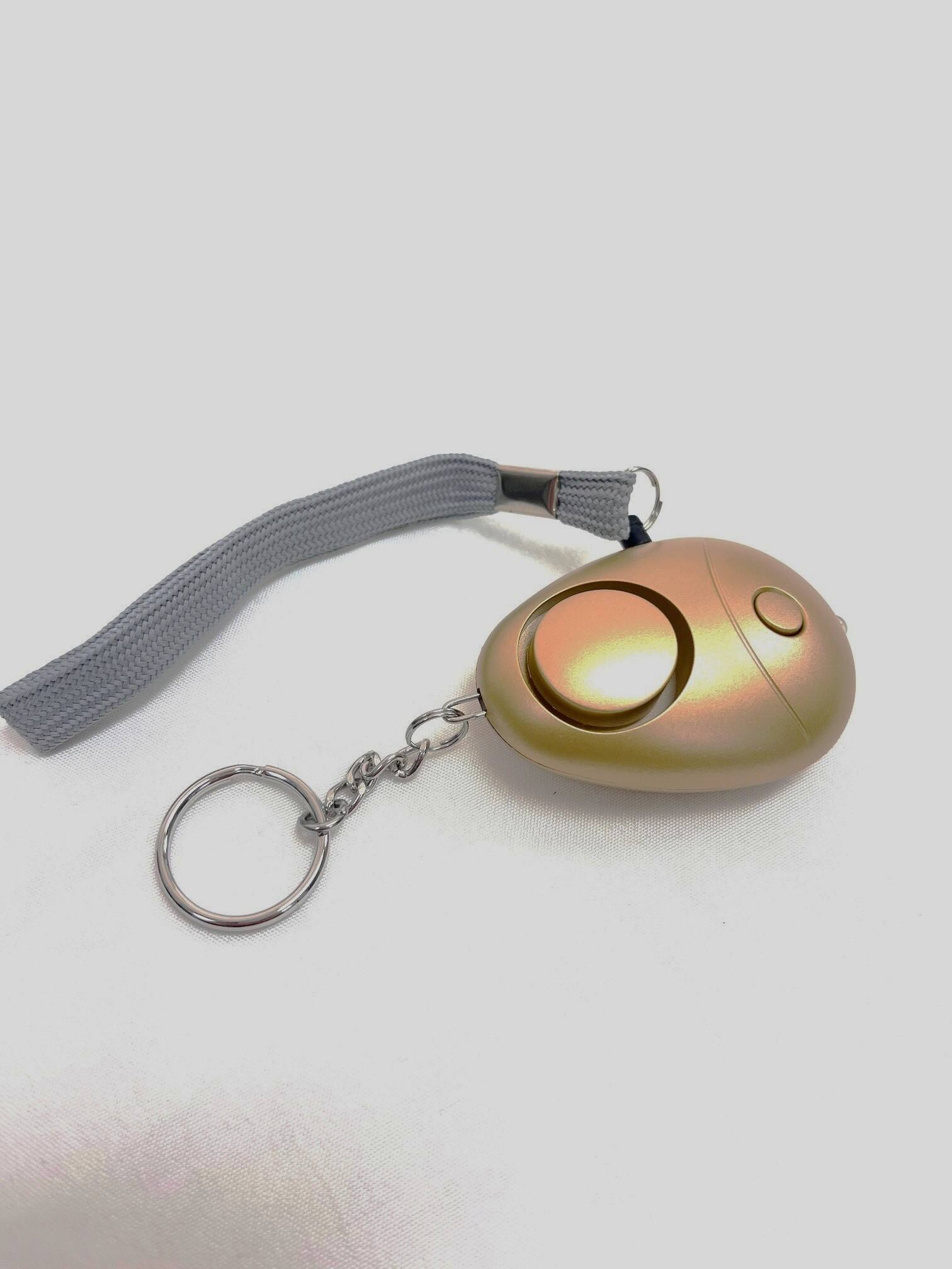 Left. SkyBluePD - Gold Breck Personal Safety Alarm - Gold.