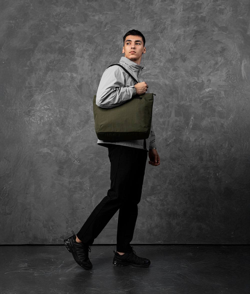 Angle. ALPAKA - Flight Tote (L) Laptop Tote Bag for Work, Large Tote Bag Fits 16" MacBook Pro, Water Bottle Pocket, Luggage Pass-Through - Green Axoflux 400D.