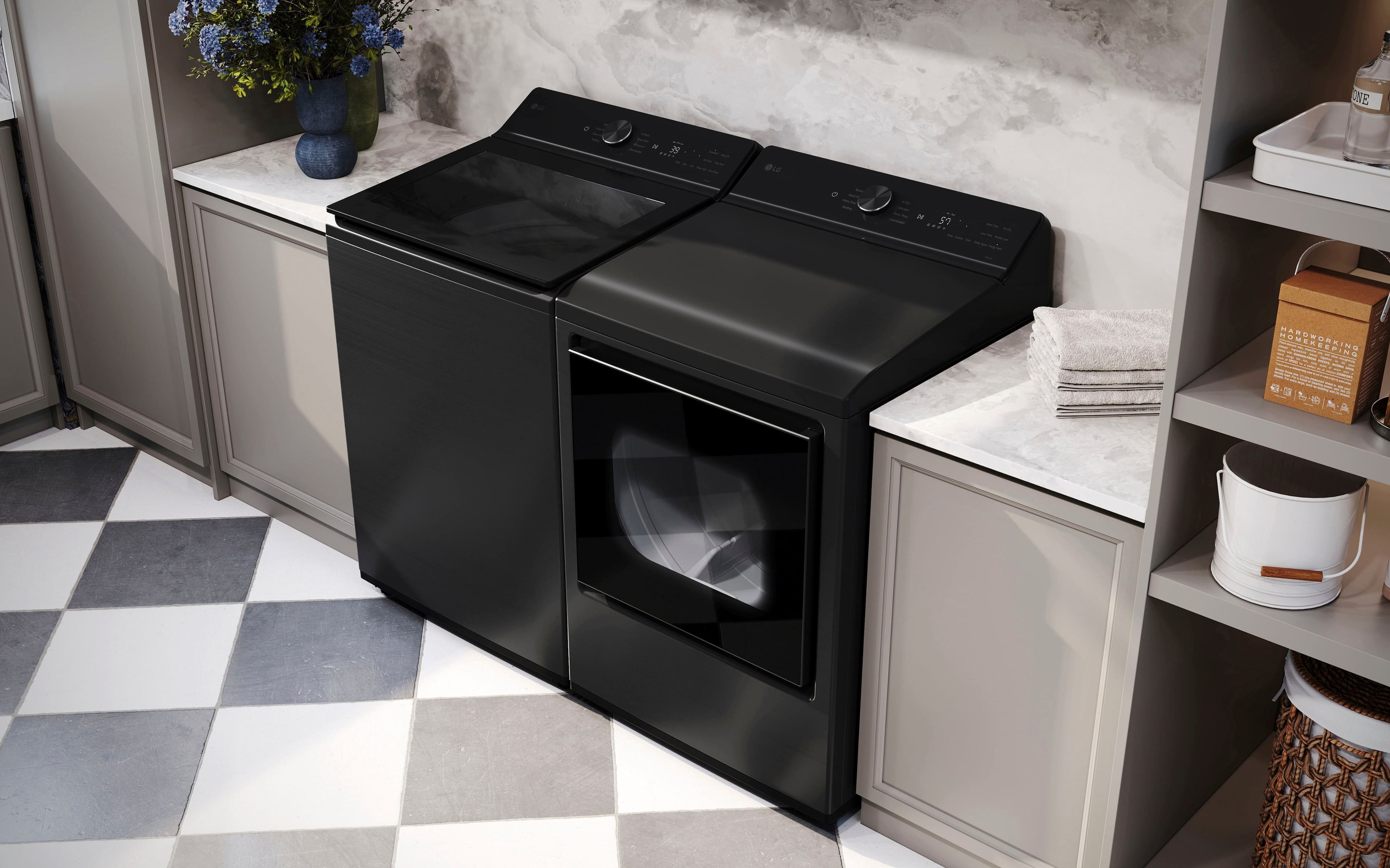 The image features a kitchen with a black dishwasher and a black stove top oven. The dishwasher is positioned next to the stove, and there is a sink nearby. The kitchen also has a countertop and a vase on the counter. The overall design of the kitchen is modern and sleek.