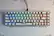 Angle. Higround - Basecamp 65+ 65% Wired Mechanical Lubed TTC Milky Switch Gaming Keyboard with RGB Backlighting - Celshade.