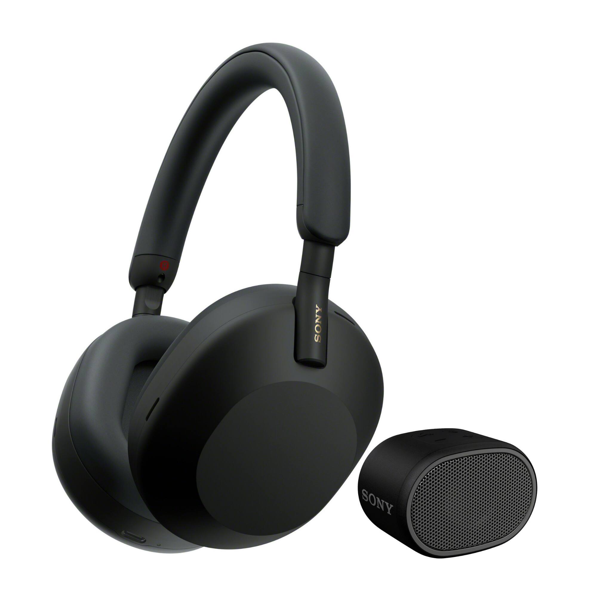 The image features a pair of black Sony headphones and a small black speaker. The headphones are designed to provide an immersive listening experience, while the speaker can be used for hands-free calls or as a portable audio device. The headphones are placed next to the speaker, showcasing their compatibility and functionality.