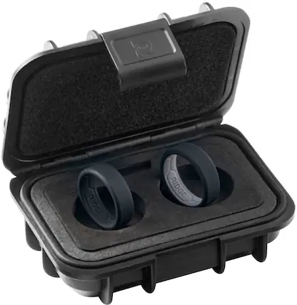 The image shows a black case with two Fitbit rings inside. The case is designed to hold the Fitbit rings securely and protect them from damage. The case has a black and gray color scheme, and the Fitbit rings are placed in separate compartments within the case. This case is a convenient way to store and transport the Fitbit rings when not in use.