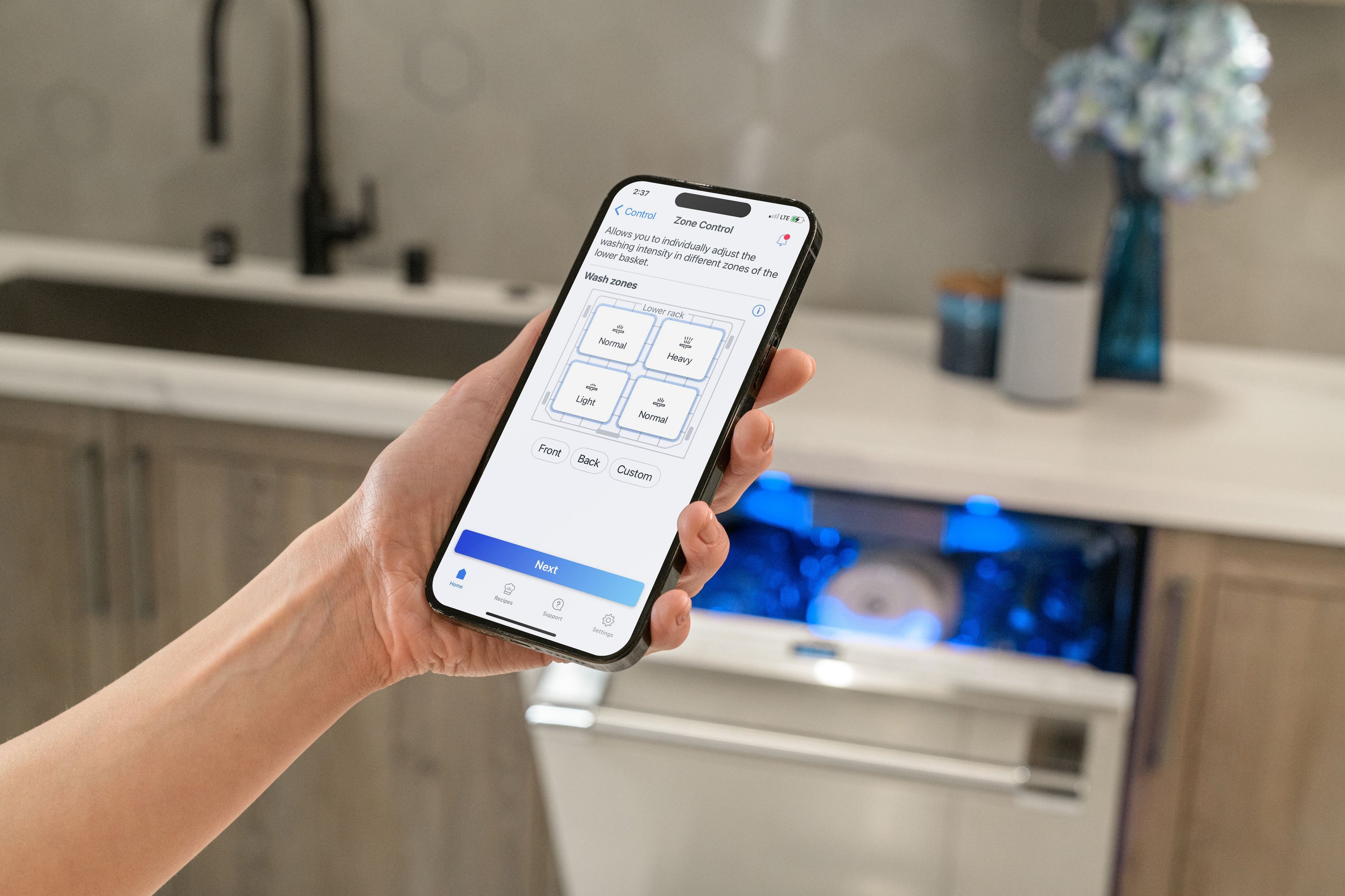 The text on the image reads:
"2:37 Control all zones Control allows you to adjust the washing intensity individually for different zones of the wash. Lower basket in different adjust the zones of the Wash zones Lower back 4 20 Normal Heavy - Light - - Normal Front Back Custom - Suees Next 7 Sson aoor."
I have grouped and corrected the text as follows:
"2:37 Control all zones. Control allows you to adjust the washing intensity individually for different zones of the wash. Lower basket in different adjust the zones of the Wash zones. Lower back 4 20 Normal. Heavy - Light - - Normal. Front Back. Custom - Suees. Next 7 Sson aoor."