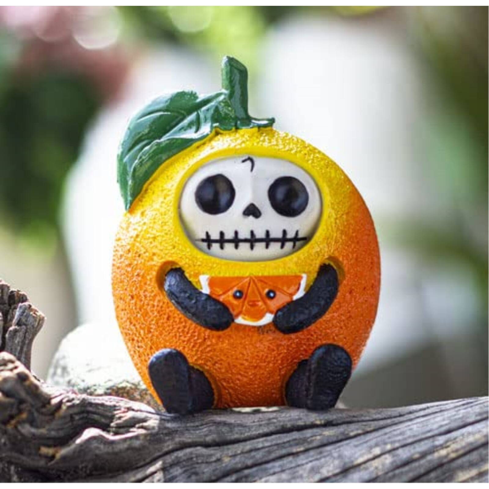 Angle. Pacific Trading - Furrybones Mikan Skeleton in a Mandarin Orange Costume Figurine - Orange.