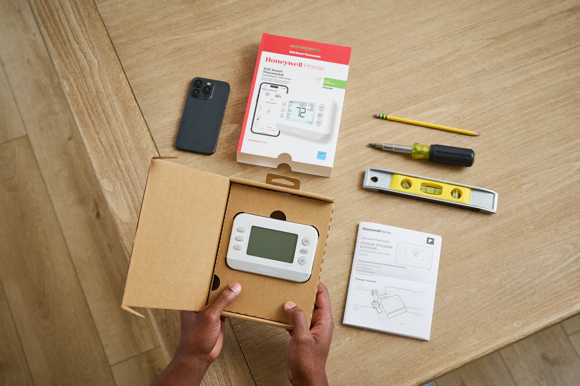 - Honeywell Home X25 Smart Thermostat
- 1:22 a% - d0 72
- Honeywell Home X25 Smart Thermostat
- W2WY WTHCJCWP
- Legislation and Compliance
- Package Includes:
  - Honeywell Home X25 Smart Thermostat
  - Installation Guide
  - Batteries
  - Screws
  - Tools (screwdriver, pencil, level)