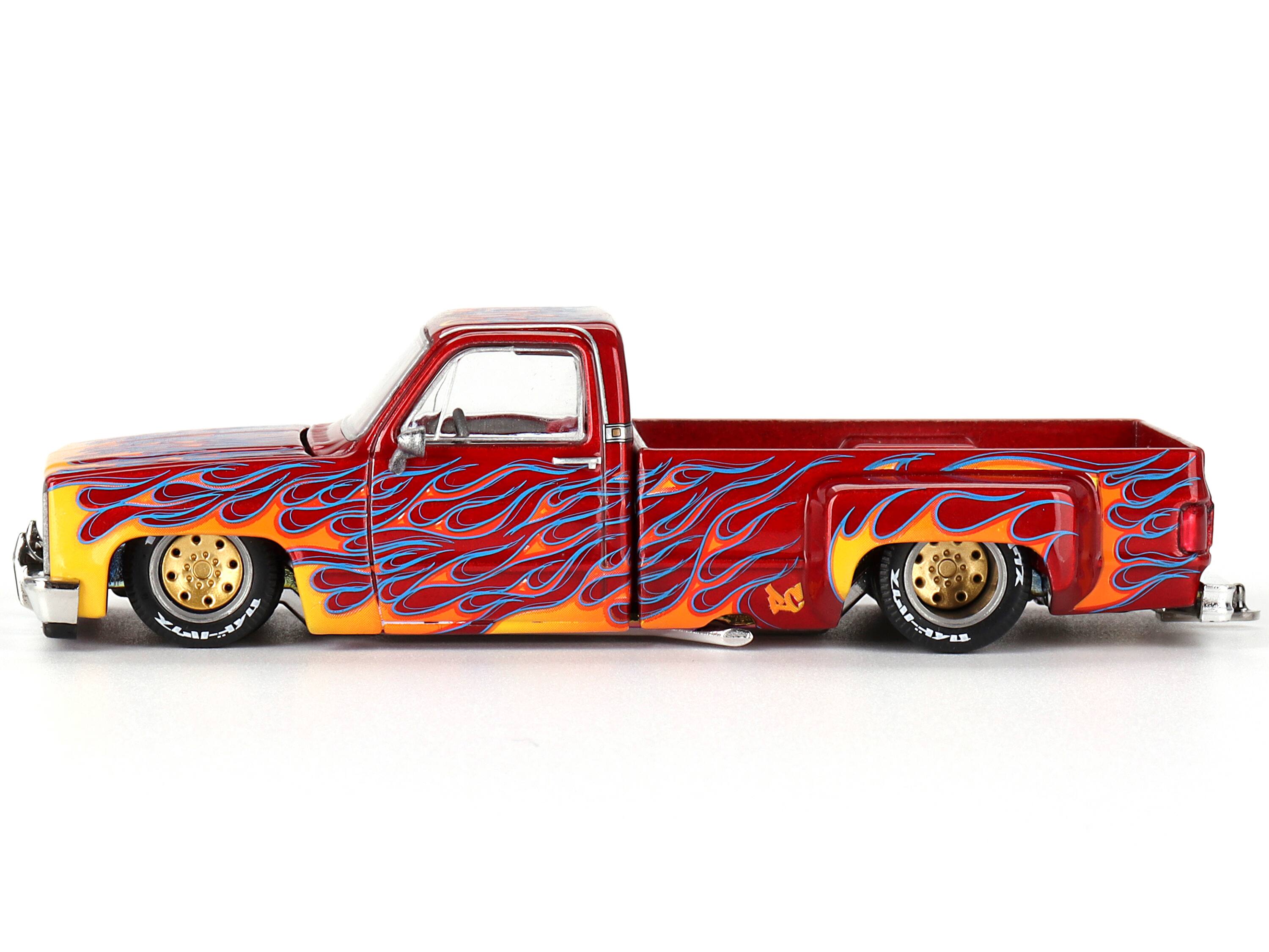 Angle. Mini GT - Chevrolet Silverado Dually Pickup On Fire V1 Red Metallic Flames Red Interior Jun Imai Kaido House 1/64 Diecast Mini GT - Red Metallic.