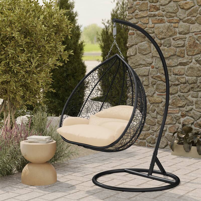 Left. LeisureMod - Recluse Modern Wicker Teardrop Hanging Egg Chair with Stand - Outdoor Indoor Swing Chair & Cushion - Cream.