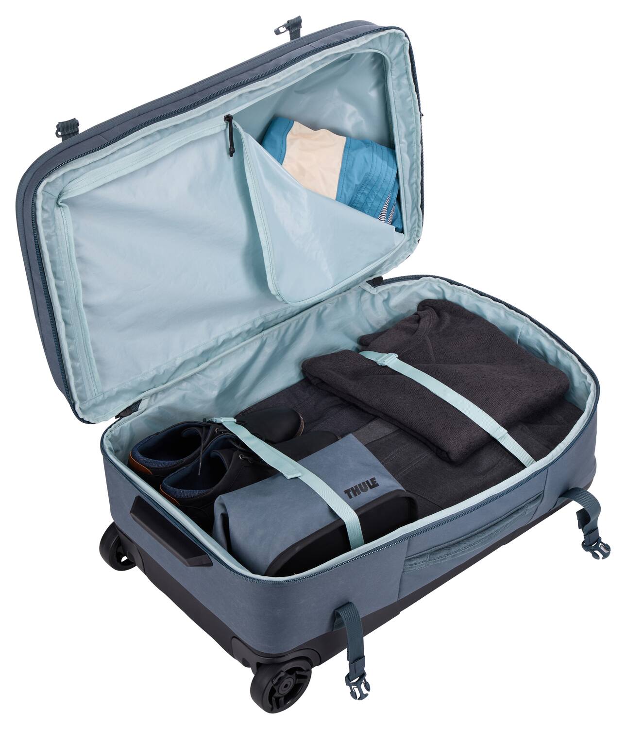 Angle. Thule - Aion Wheeled Duffel – 70cm Eco-Friendly Rolling Travel Bag - Dark Slate.