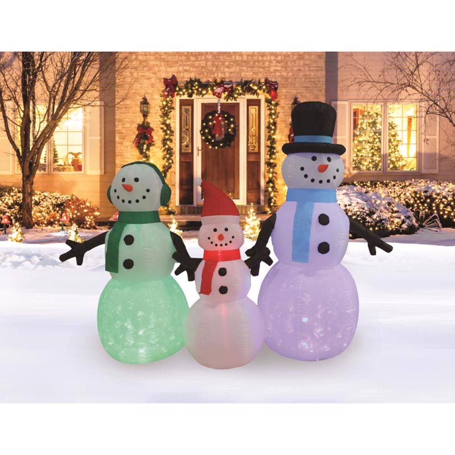 Left. A Holiday Company - A Holiday Company LED Multi Snowman family 6 ft. Inflatable - Multicolored.