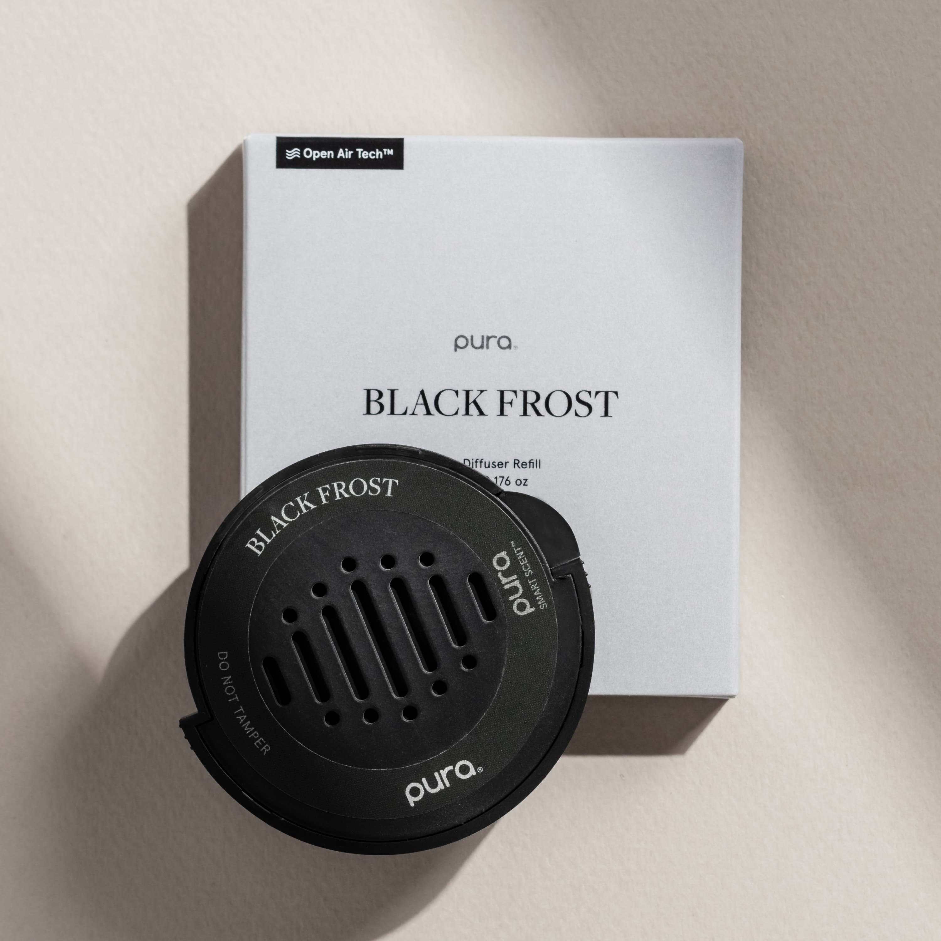 The text on the image reads: "Open Air Tech pura. BLACK FROST Diffuser Refill 176 oZ FROST BLACK SCENT pura SMART DO NOT TAMPER pura."