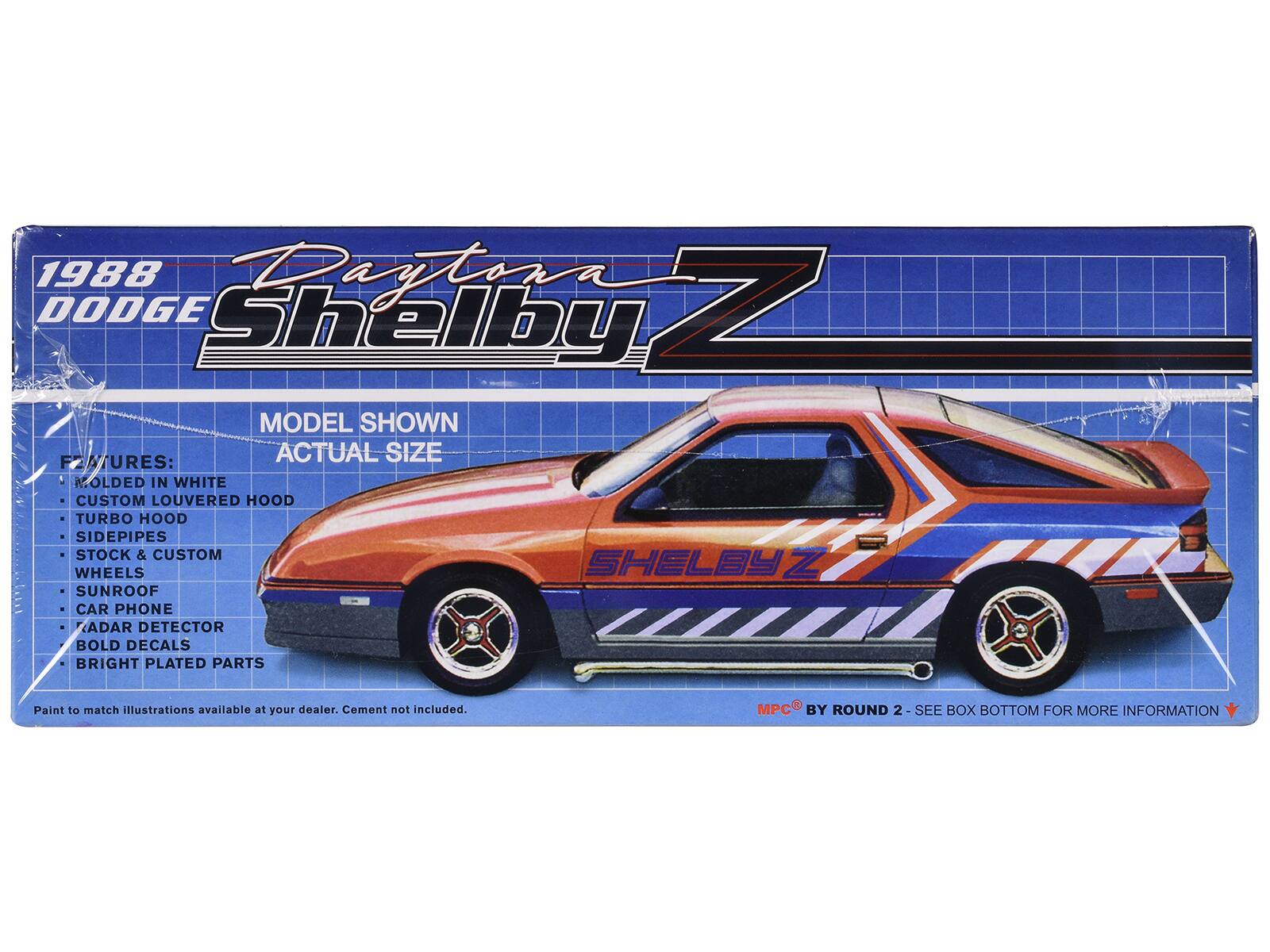 1988 Dodge Shelby Z

MODEL SHOWN: ACTUAL SIZE

FEATURES:
- MOLDED IN WHITE
- CUSTOM LOUVERED HOOD
- TURBO HOOD
- SIDEPIPES
- STOCK & CUSTOM WHEELS
- SUNROOF
- CAR PHONE
- RADAR DETECTOR
- BOLD DECALS
- BRIGHT PLATED PARTS

Paint to match illustrations available at your dealer. Cement not included.

MPC BY ROUND 2 - SEE BOX BOTTOM FOR MORE INFORMATION