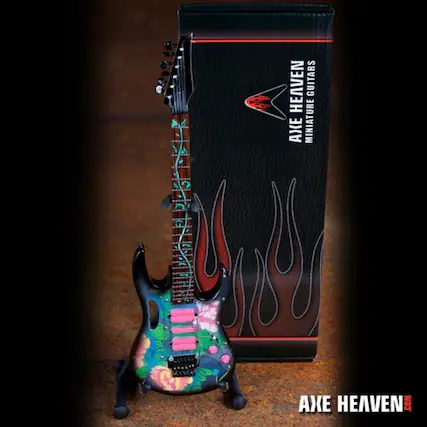 The corrected text is: "AXE HEAVEN GUITARS AXE MINIATURES HEAVEN.COM"