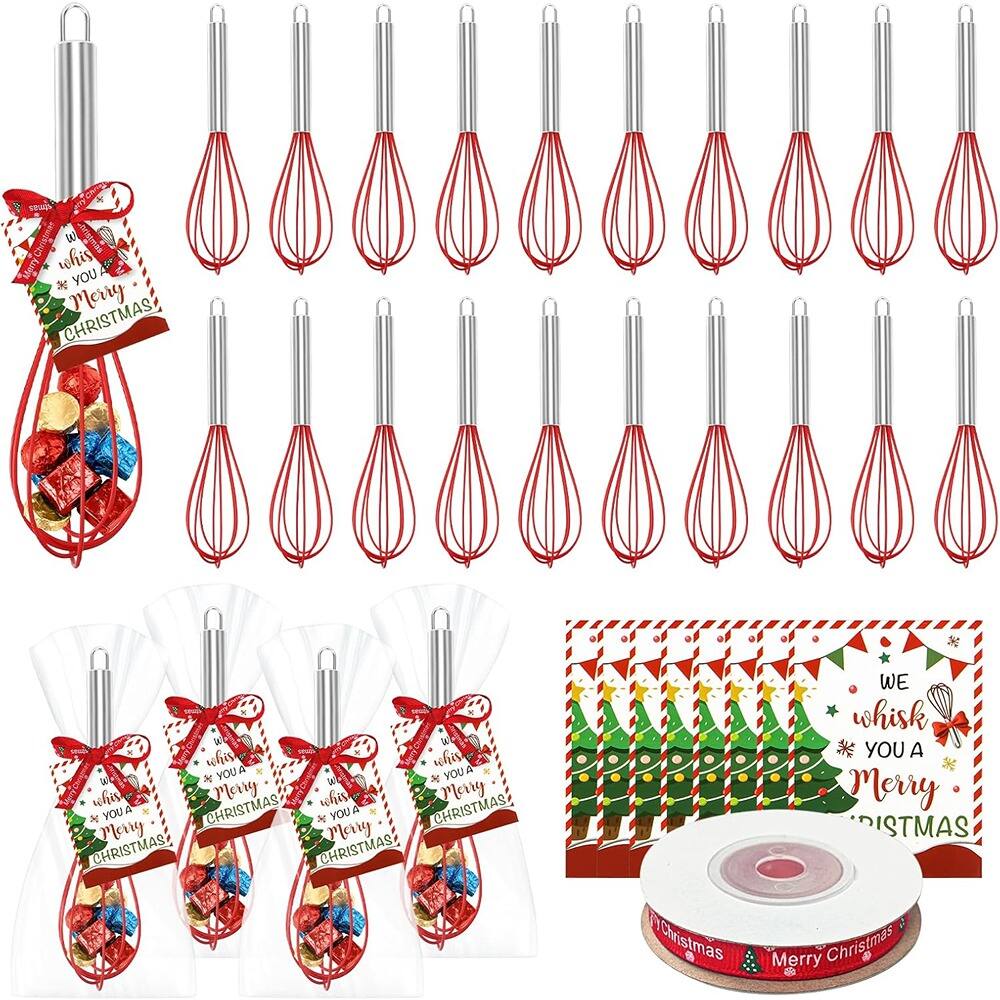 Sure, here is the corrected and grouped text from the image:
---
**Whisk Set:**
- "We whisk you a Merry Christmas!"
**Gift Bags:**
- "We whisk you a Merry Christmas!"
**Roll of Tape:**
- "Merry Christmas"
**Banner:**
- "We whisk you a Merry Christmas!"
---