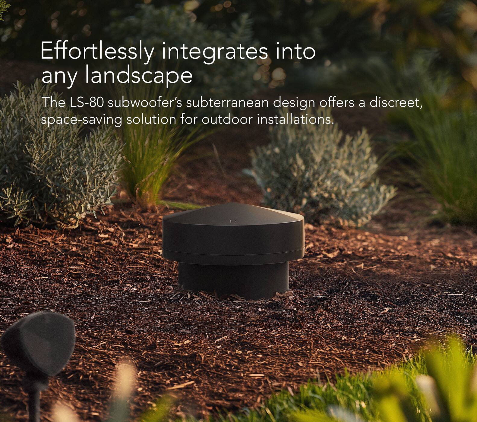 The LS-80 subwoofer's subterranean design offers a discreet, space-saving solution for outdoor installations, effortlessly integrating into any landscape.