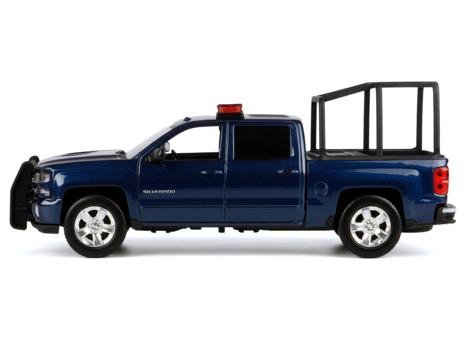 Alt View 2. Motormax - 2017 Chevrolet Silverado 1500 LT Z71 Crew Cab Truck with Bed Cage Dark Blue w/Lights & Sounds 1/27 Model Car by Motormax.