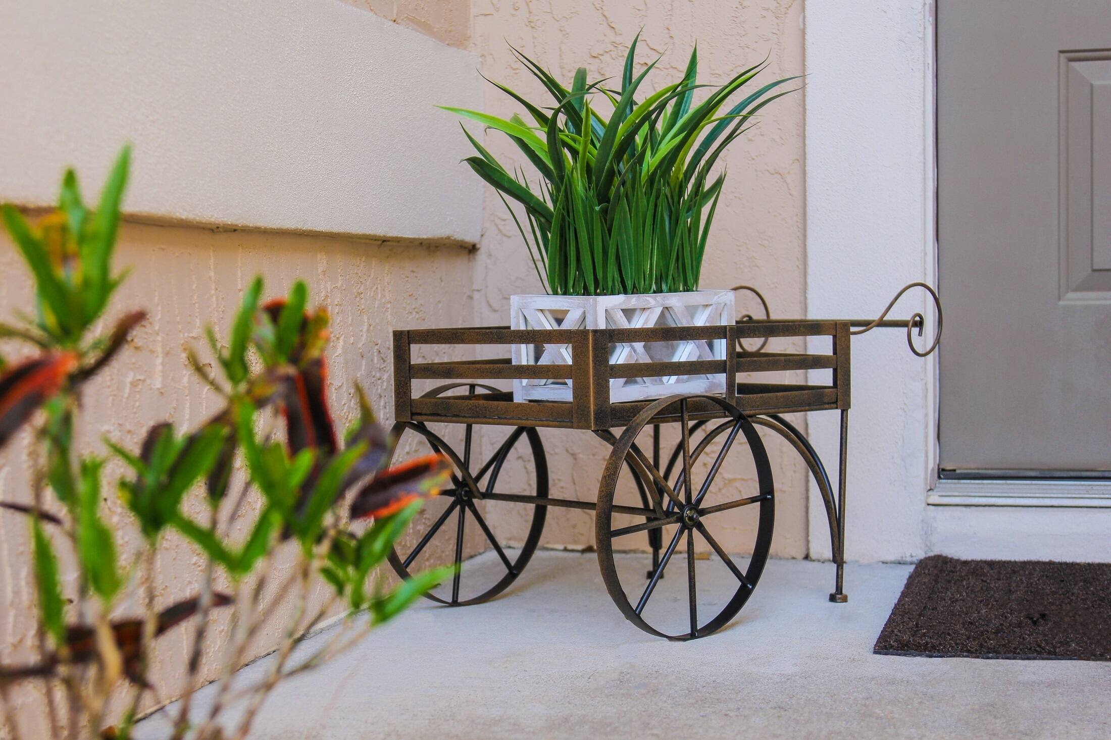 Alt View 4. Zeckos - 26 Inch Rustic Metal Wagon Cart Plant Stand Flower Holder Patio Art Garden Decor - Brown.