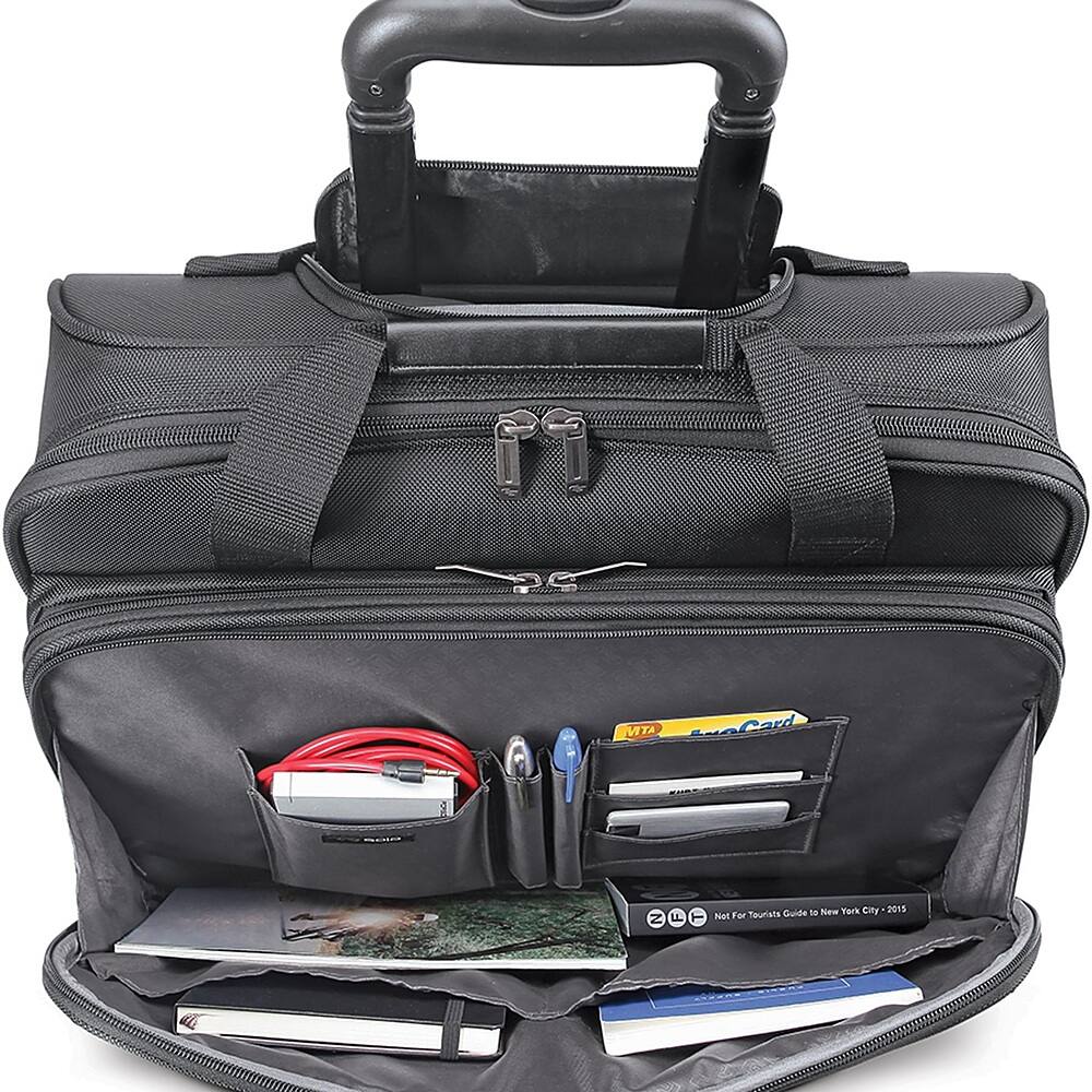 The black briefcase is open and filled with various items, including a wallet, pens, and a cell phone. The wallet is located on the left side of the briefcase, while the pens are placed in the middle. The cell phone is positioned towards the right side of the briefcase. The briefcase is also equipped with a handle for easy transportation.