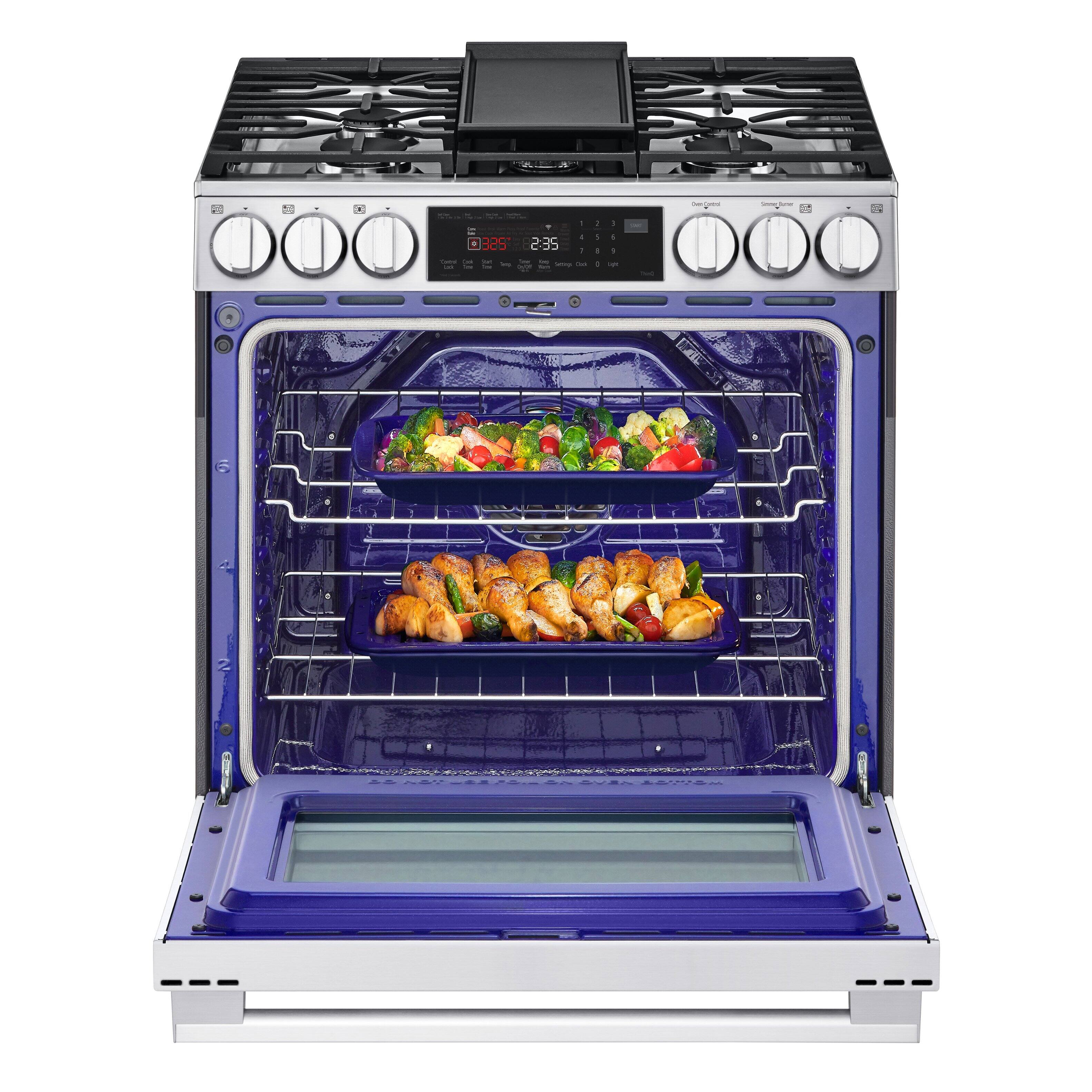 The image shows a blue oven with two trays of food inside. The oven is set to 325 degrees Fahrenheit, and the timer is set for 2:35. The food is being cooked in the oven, and the oven appears to be a modern, stainless steel model.