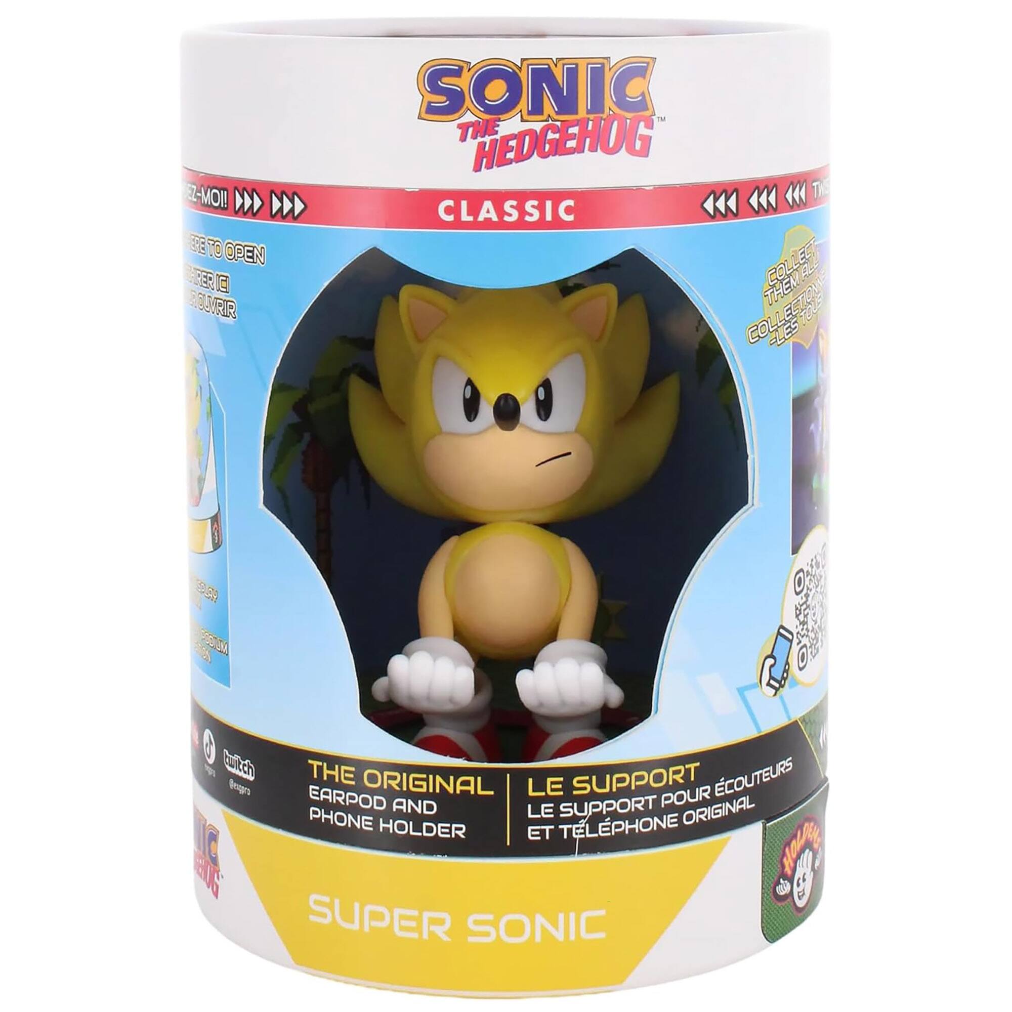 The image features a box containing a Sonic the Hedgehog Classic toy. The box is white and blue, with a picture of the toy on the front. The toy is a representation of the character Super Sonic, and it is designed to be used as a phone holder. The box also includes a booklet, which likely provides information about the toy and its features.