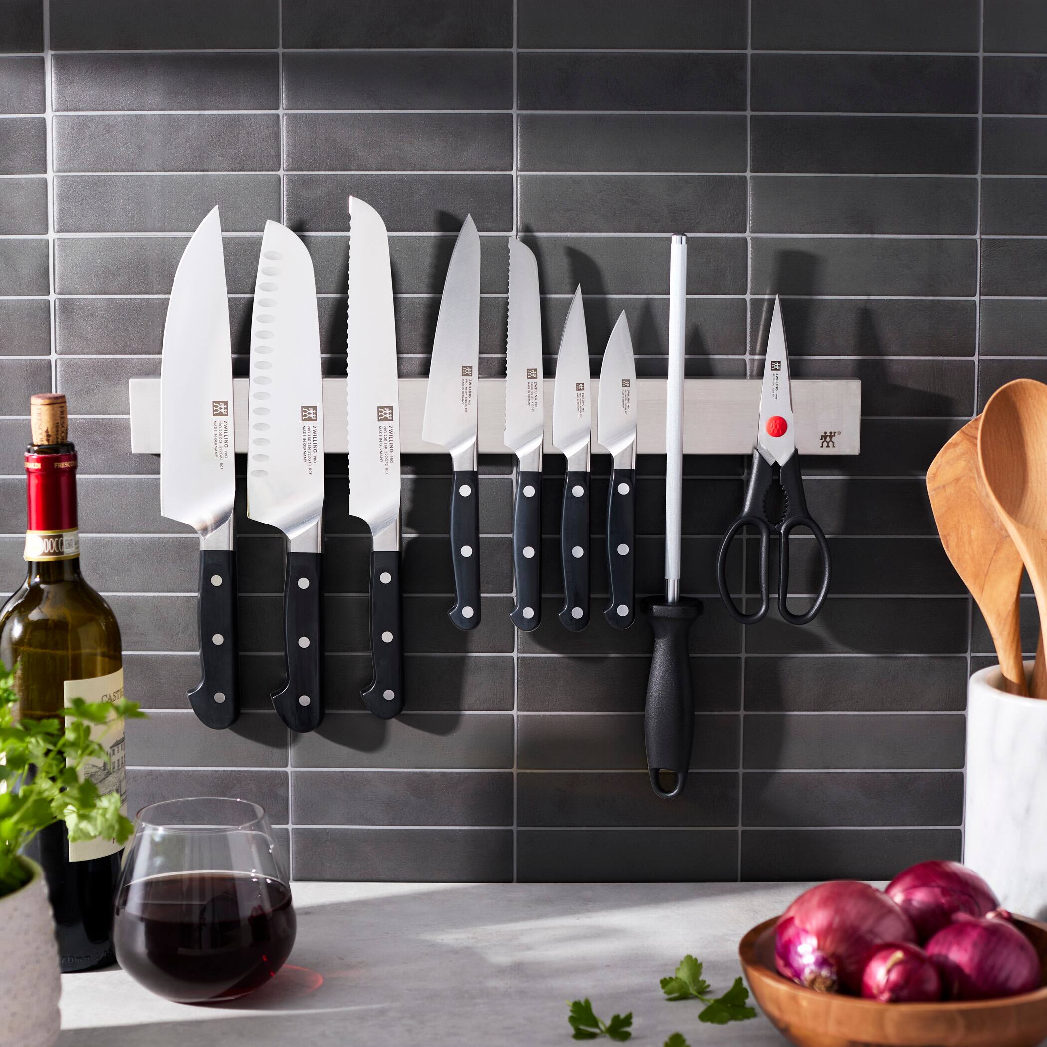 The text on the knives reads:

"ZWILLING
J.A. HENCKELS
PRECISION EDGE
GERMANY"