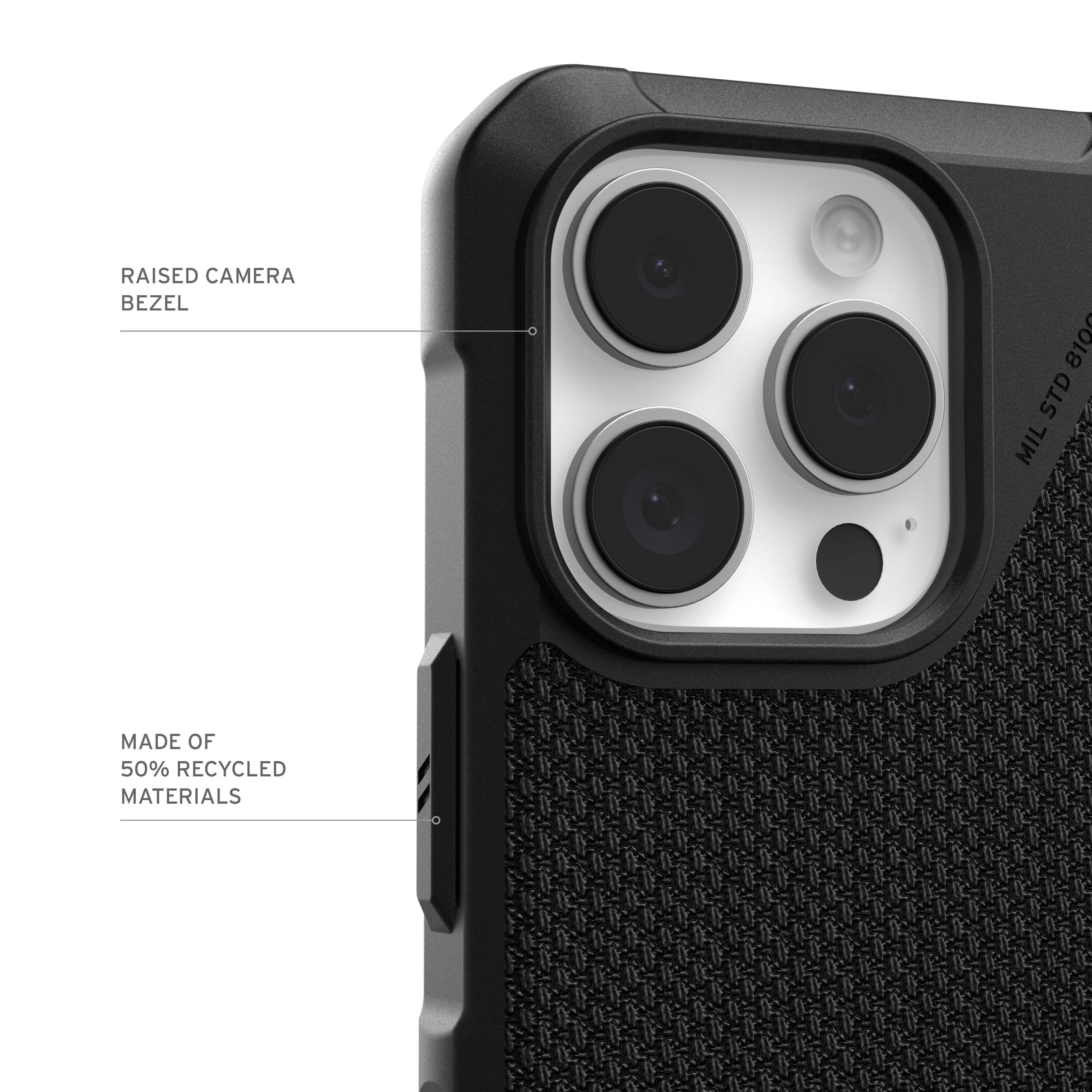 The image features a close-up of a cell phone, specifically focusing on the camera lens. The text on the image reads: "Raised Camera Bezel 810 STD MIL Made of 50% Recycled Materials." This suggests that the camera lens is part of a cell phone case that has a raised bezel, and it is made of 50% recycled materials.