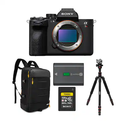 The image features a Sony camera and accessories, including a backpack, a tripod, and a memory card. The camera is an E-mount a 7R, and the memory card is a Tough 320GB GH CF card. The backpack and tripod are essential for carrying and stabilizing the camera during outdoor shoots.
