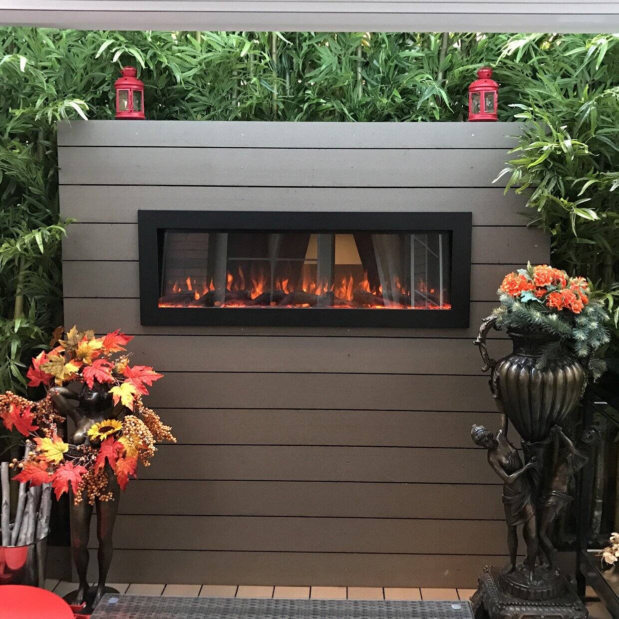 Angle. Touchstone Home Products - 50 in. Wall Mounted Recessed Sideline Outdoor Smart Electric Fireplace - Black.