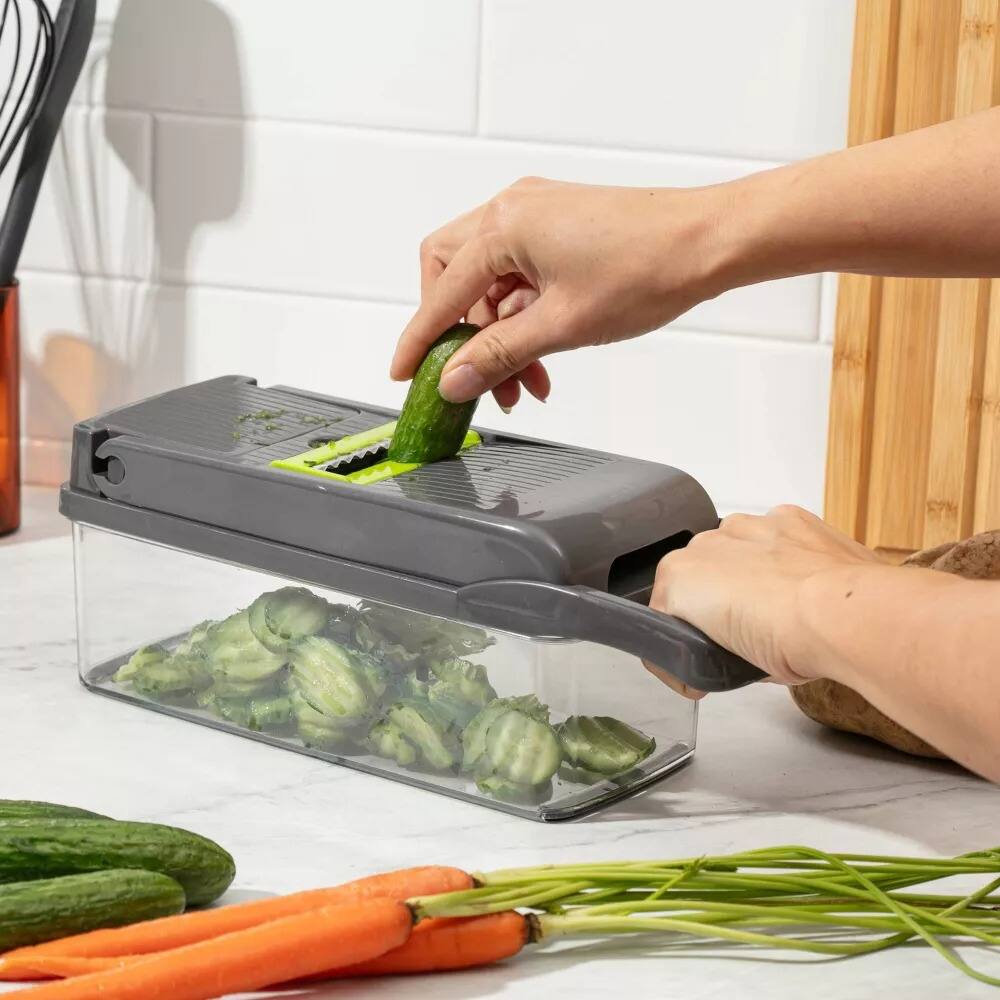 Left. Luminuxe - All-In-One Vegetable Chopper & Meal Prep Container with 7 Blades and Strainer Basket.