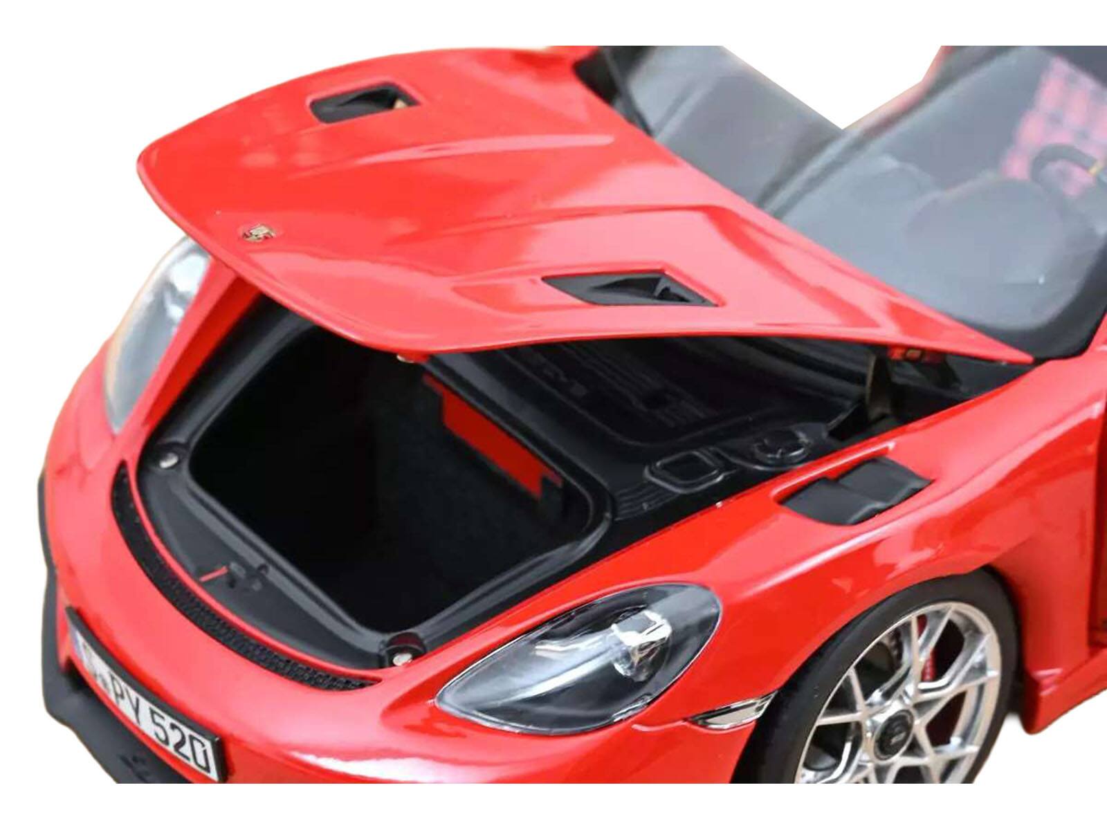 Angle. Norev - 2023 Porsche 718 Spyder RS Guards Red 1/18 Diecast Model Car by Norev - Red.