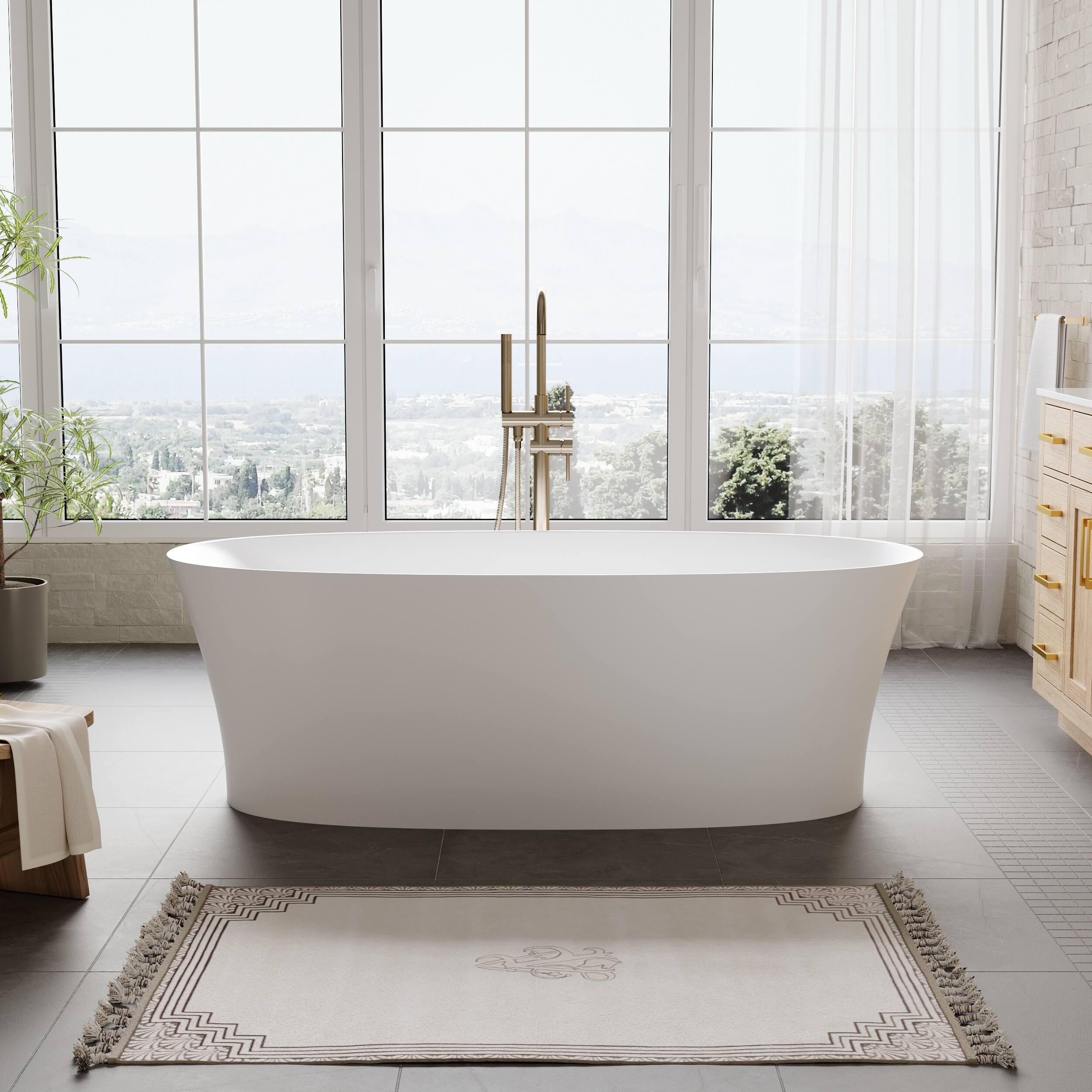 Front. WELLFOR - SOLUX 30.71 in x 66.93 in Matte White Solid Surface Oval Freestanding Soaking Bathtub with Drain ( Reversible Drain ) - White.