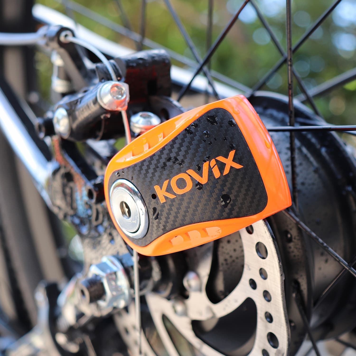 Angle. Jupiter Bikes - Kovix Brake Rotor Bicycle Lock w/ 120 decibel Alarm - 6mm locking pin - Alloy steel construction - disc-style lock - Bare Metal.