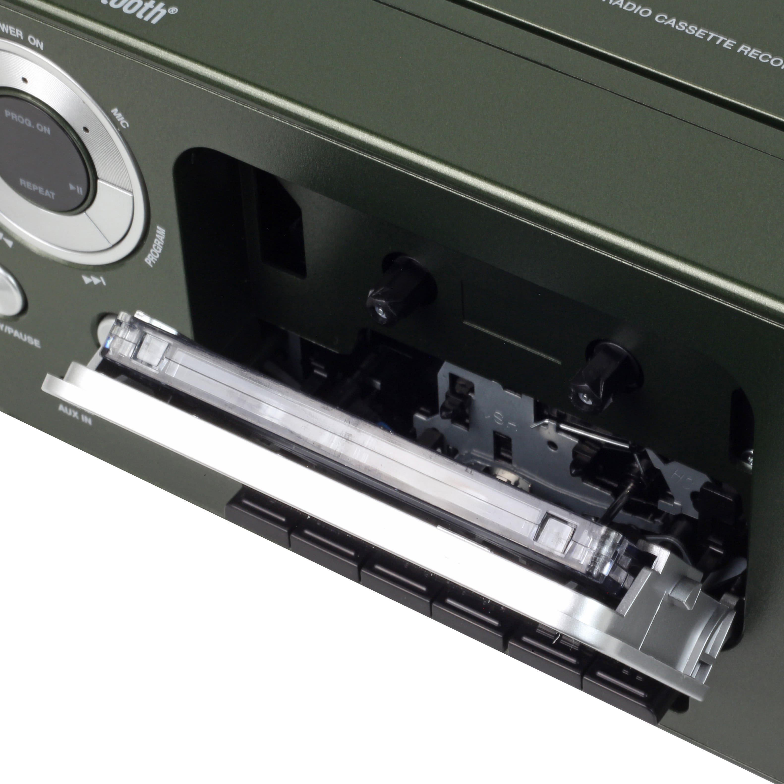 The text on the image reads: "WER ON 100th ADIO CASSETTE RECO. PROG. ON MIC REPEAT > ! A PROGRAM U/PAUSE". This text is likely related to a cassette recorder, as it refers to a program and a pause function. The text could be interpreted as a description of the recorder's features or instructions for using the device.