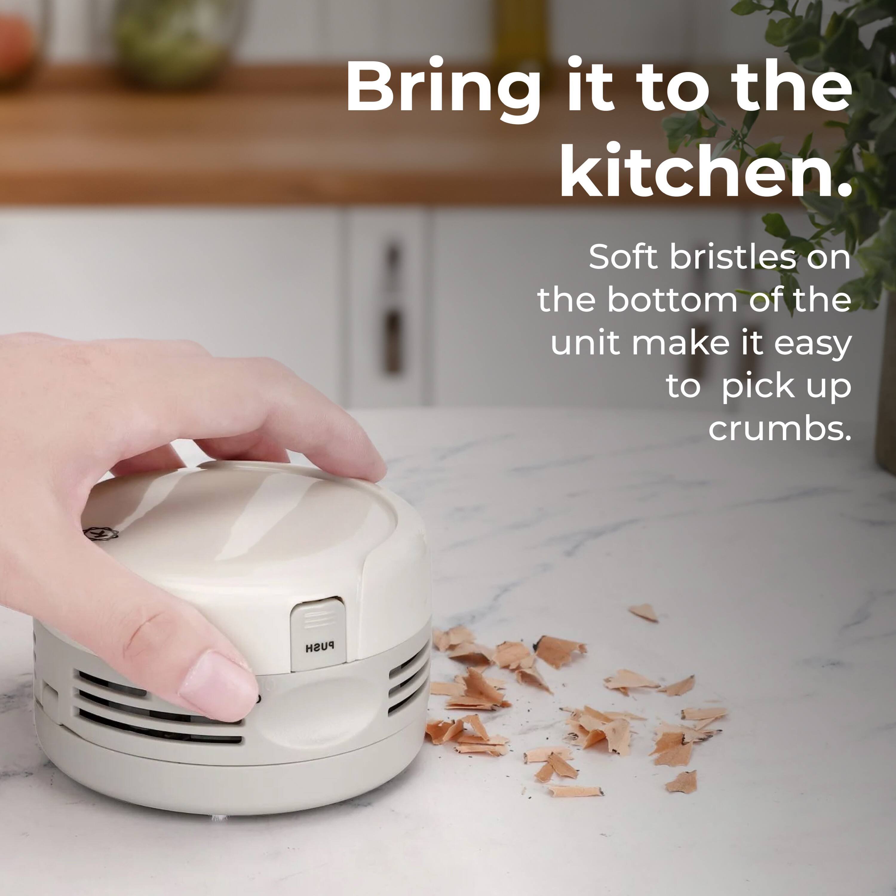 Bring it to the kitchen. Soft bristles on the bottom of the unit make it easy to pick up crumbs. PUSH