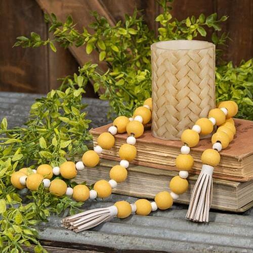 Left. BreeBe - Distressed Yellow and White Bead Garland w/Tassels - Yellow and White.