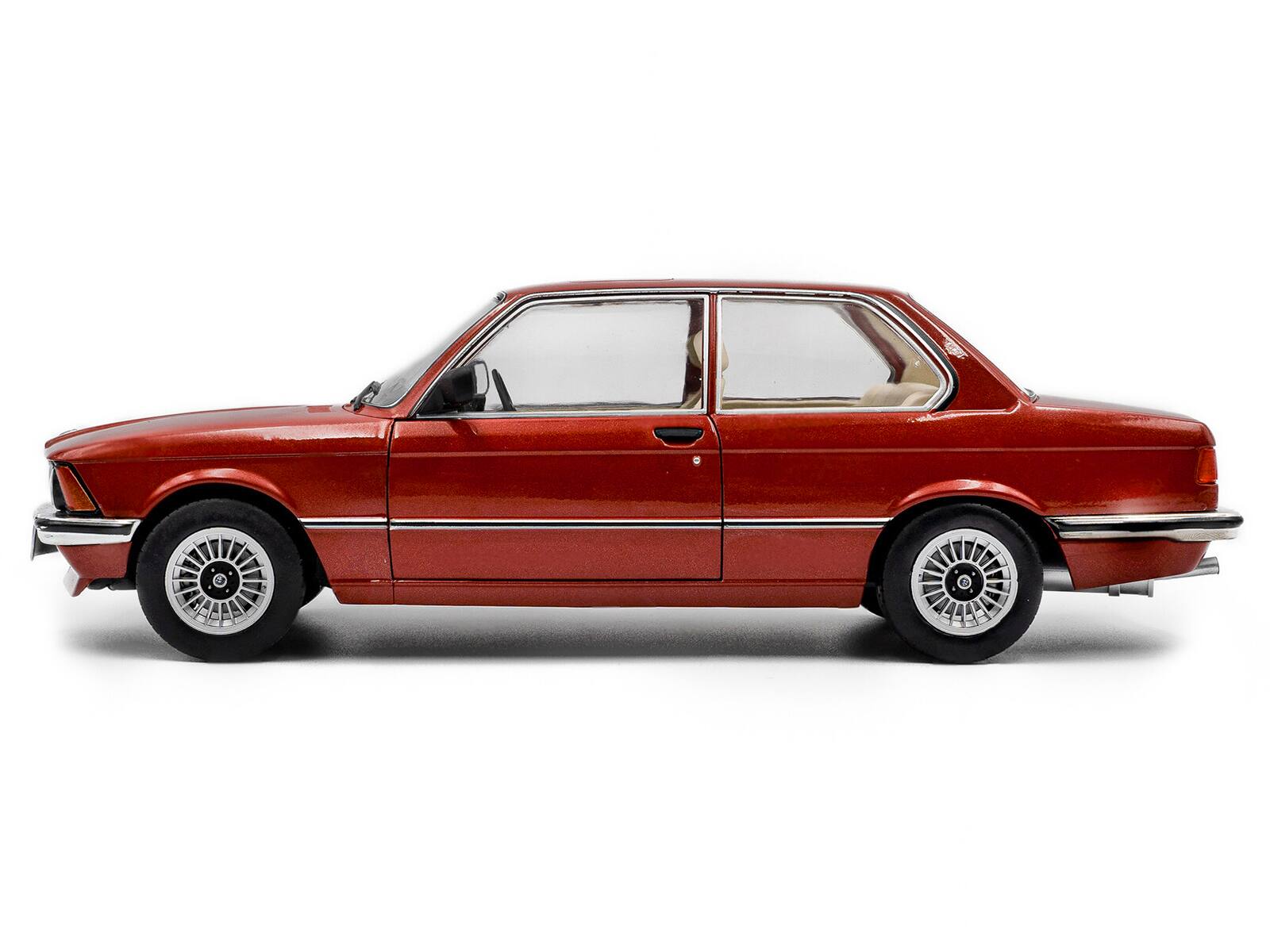 Left. Solido - 1980 BMW 323i Ruby Red Metallic 1/18 Diecast Model Car by Solido - Ruby Red Metallic.