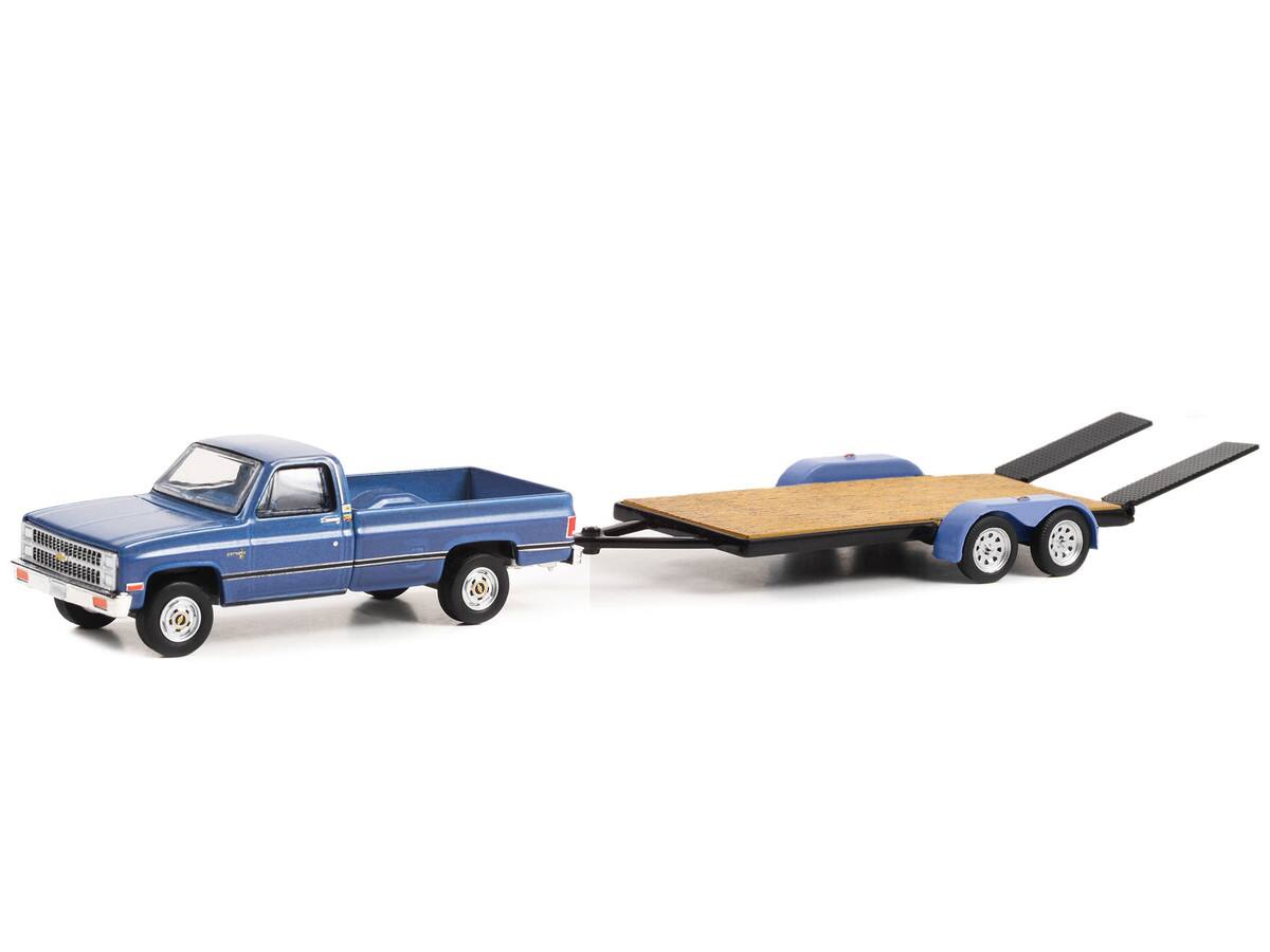 Angle. Greenlight - 1981 Chevrolet C-20 Trailering Special Pickup Blue/Black with Flatbed Trailer "Hitch & Tow" Series 27 1/64 - Blue with Black.