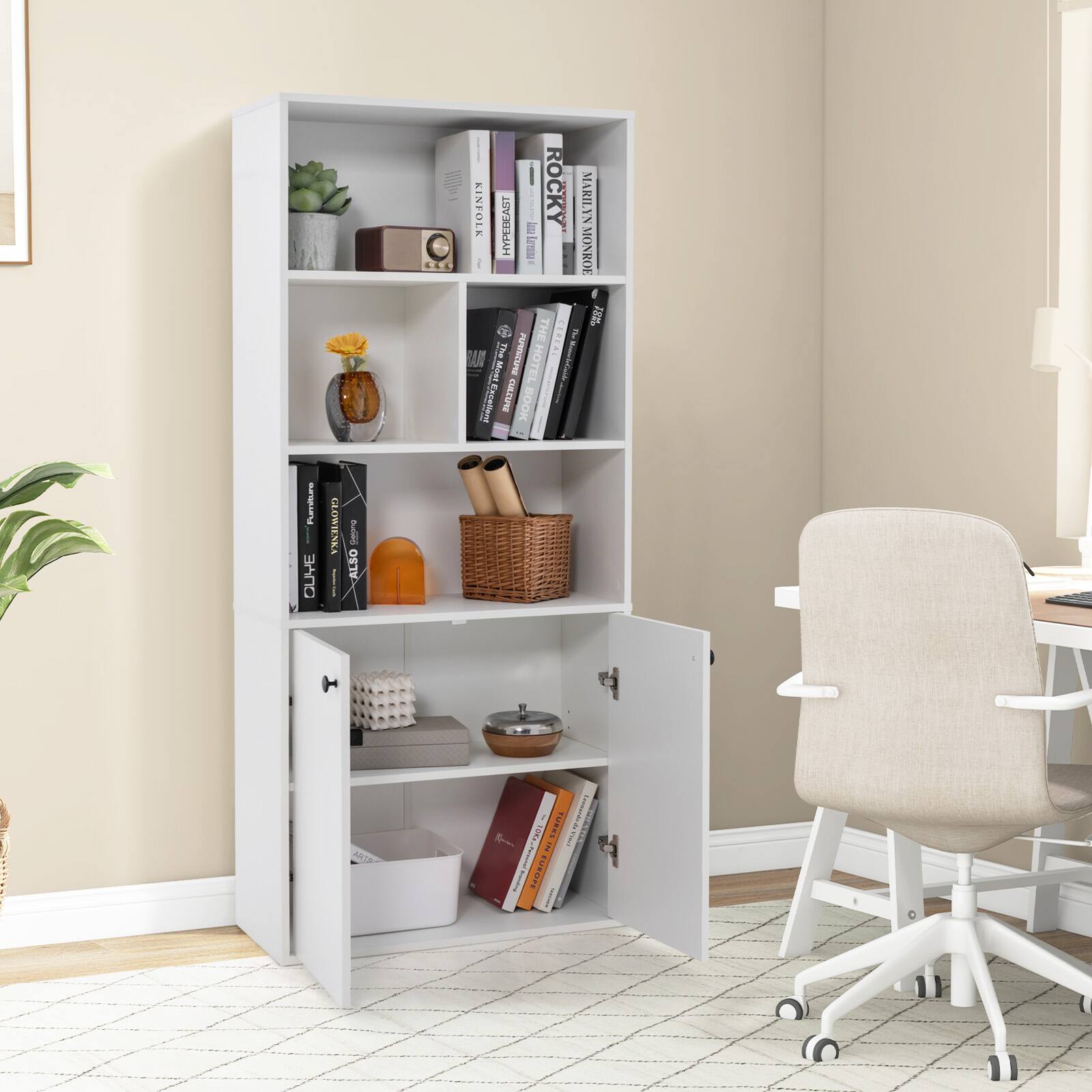 The image features a white bookshelf filled with books and a basket. The bookshelf is located in a room with a chair and a desk. The books on the shelf are arranged in a way that makes it easy to access and read them. The room also has a potted plant, adding a touch of greenery to the space. The overall atmosphere of the room appears to be cozy and inviting, perfect for reading and relaxing.