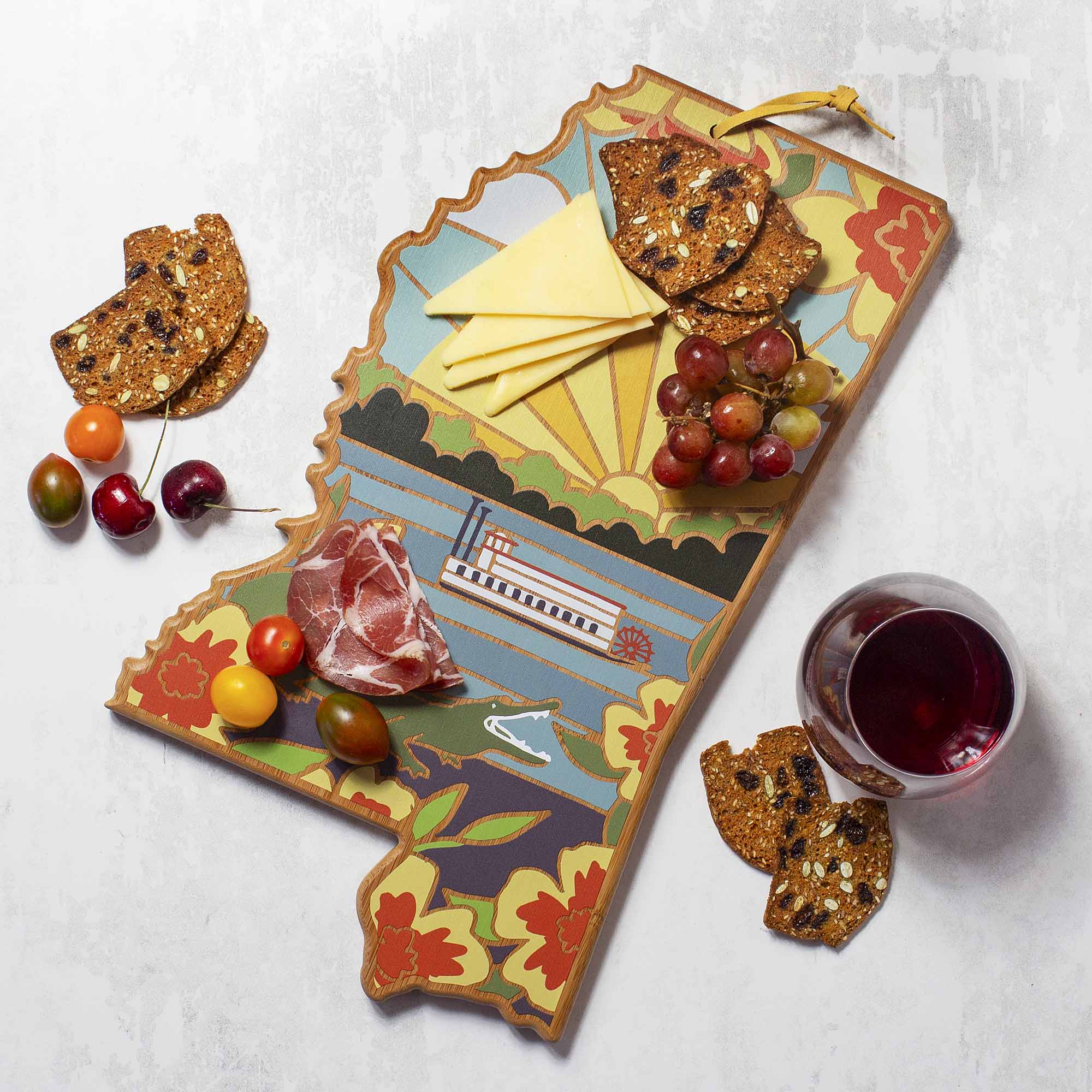 Angle. Totally Bamboo - Mississippi Cutting Board with Artwork by Summer Stokes.