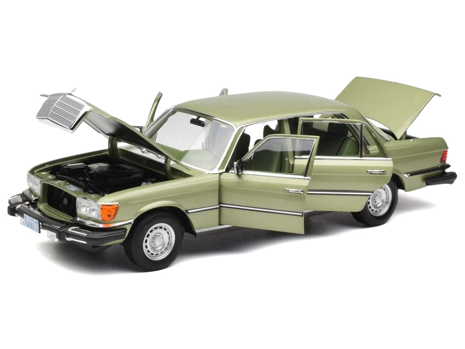 Angle. Norev - 1979 Mercedes-Benz 450 SEL (US Version) Silver Green Metallic with Green Interior 1/18 Diecast Model Car by Norev - Silver, Green Metallic.