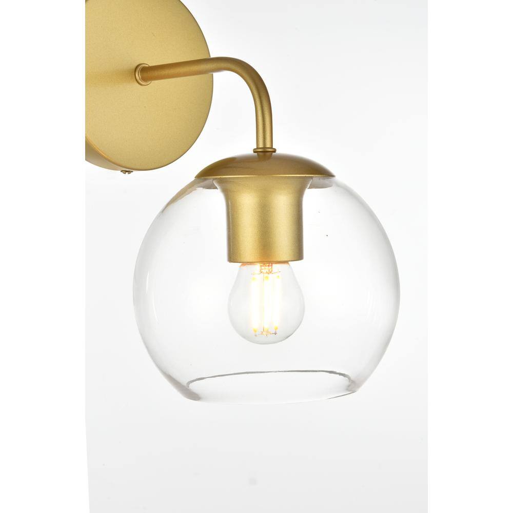 Left. Living District - Genesis 1 light Brass and Clear Bath Sconce - Brass And Clear.