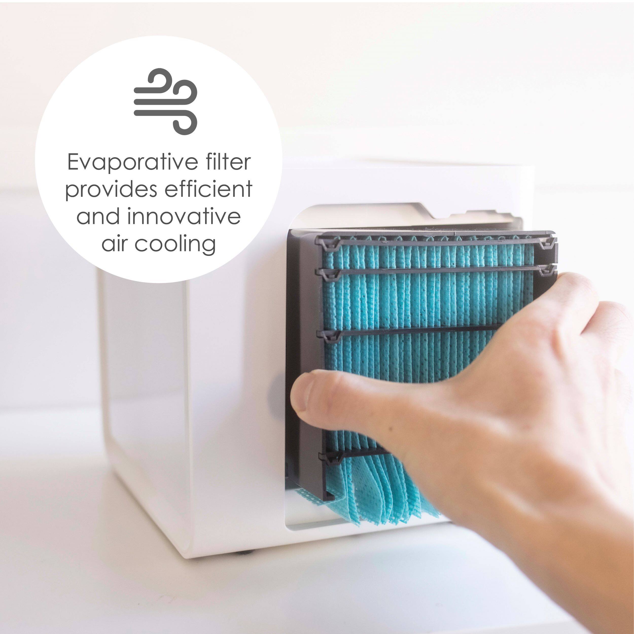 The image shows a person holding a blue evaporative filter in front of a white box. The evaporative filter is designed to provide efficient and innovative air cooling. The person is likely demonstrating the use of the filter or explaining its features.