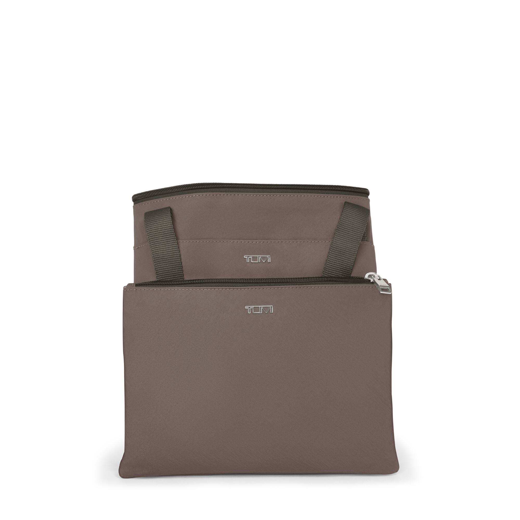 The text on the image is "TUMI."