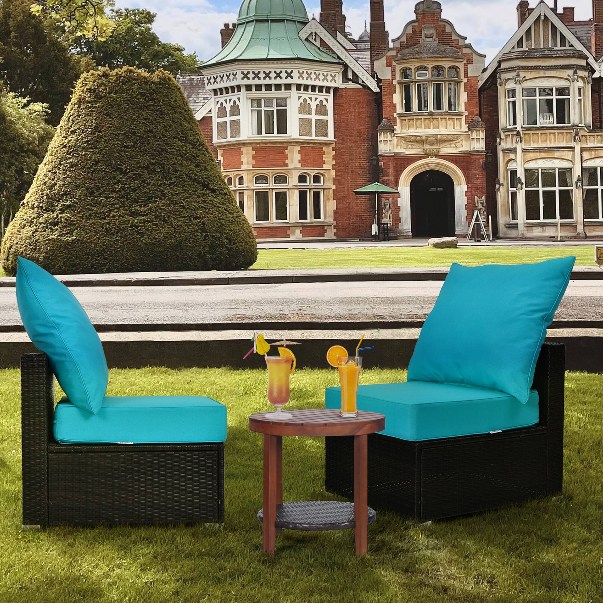 The image does not contain any visible text to group or correct. It shows a garden setting with two lounge chairs, a small table with drinks, and a large building in the background.