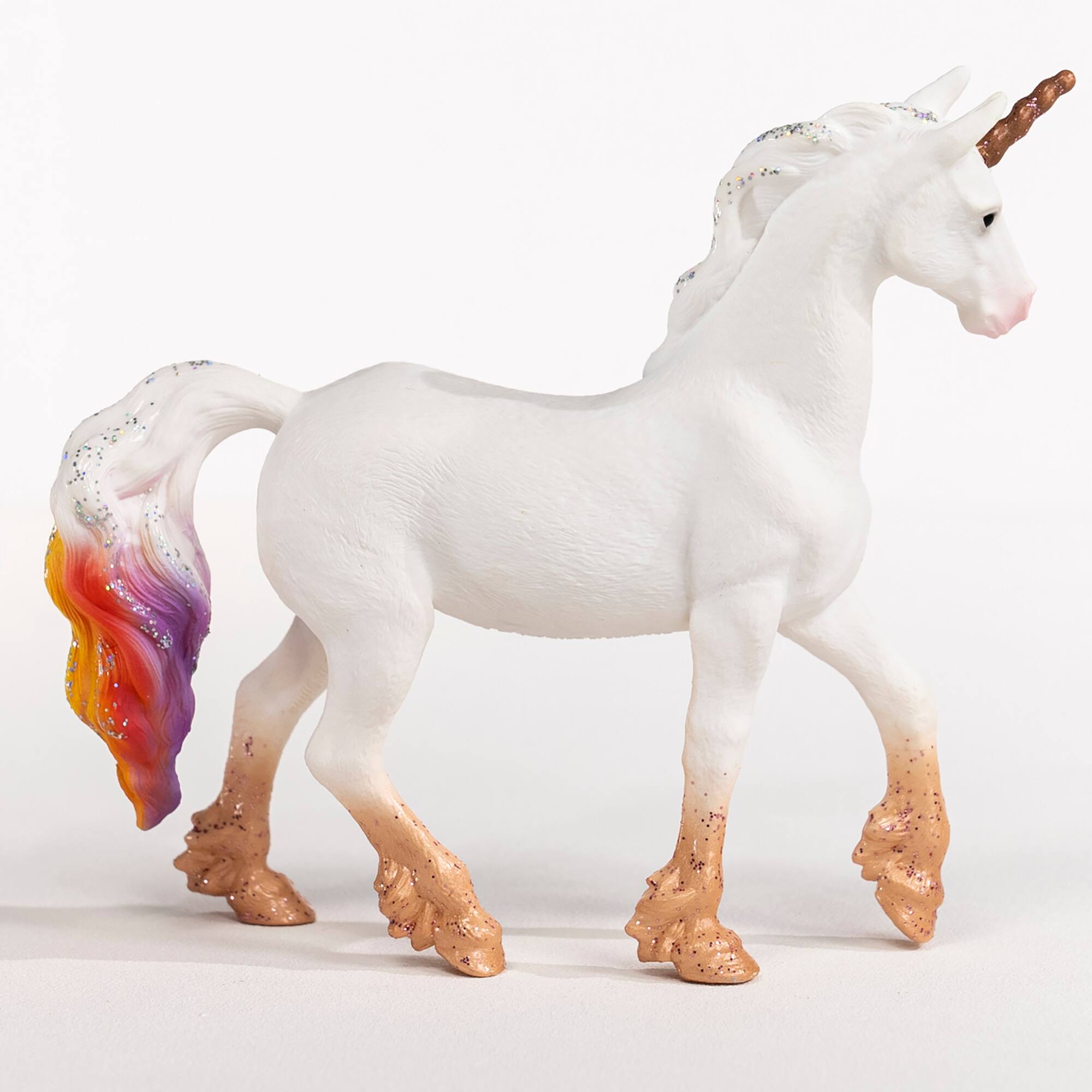 Left. Schleich - Bayala: Rainbow Love Unicorn Mare.