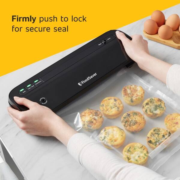 Firmly push to lock for secure seal  
Ay - eat - FoodSaver