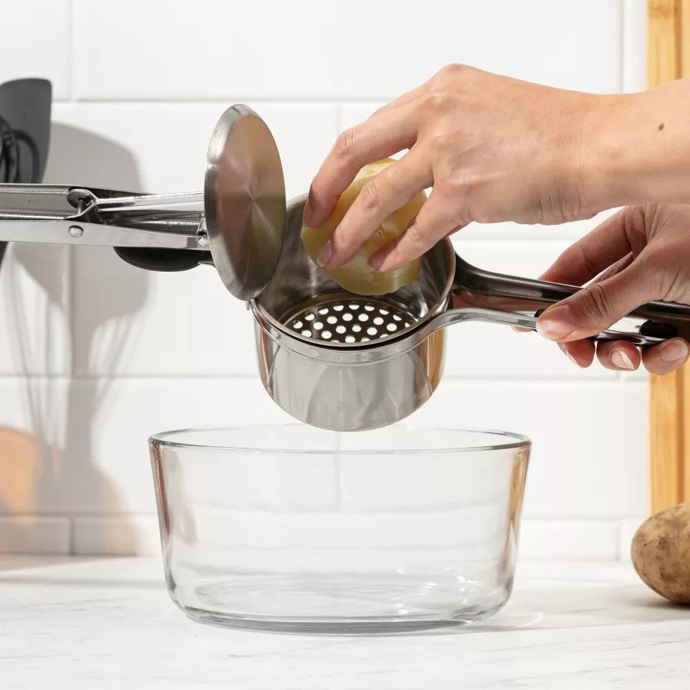 Left. Luminuxe - 15oz Potato Ricer, Heavy Duty Stainless Steel Potato Masher and Ricer, Nonslip Handle.