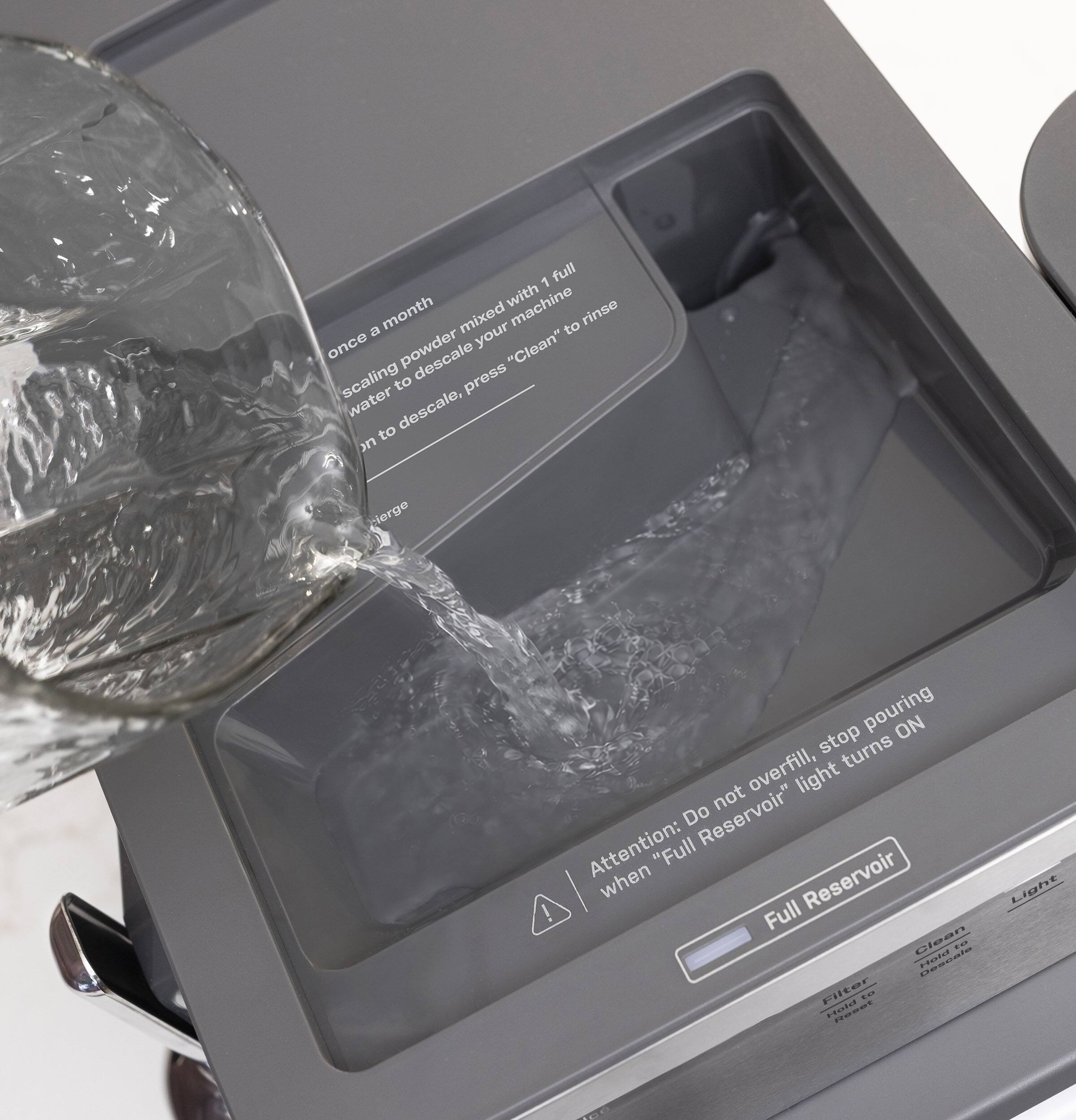 once a month scaling powder mixed with water to descale your machine, press "Clean" to descale, "Clean" to rinse

Attention: Do not overfill, stop pouring when "Full Reservoir" light turns ON

Full Reservoir