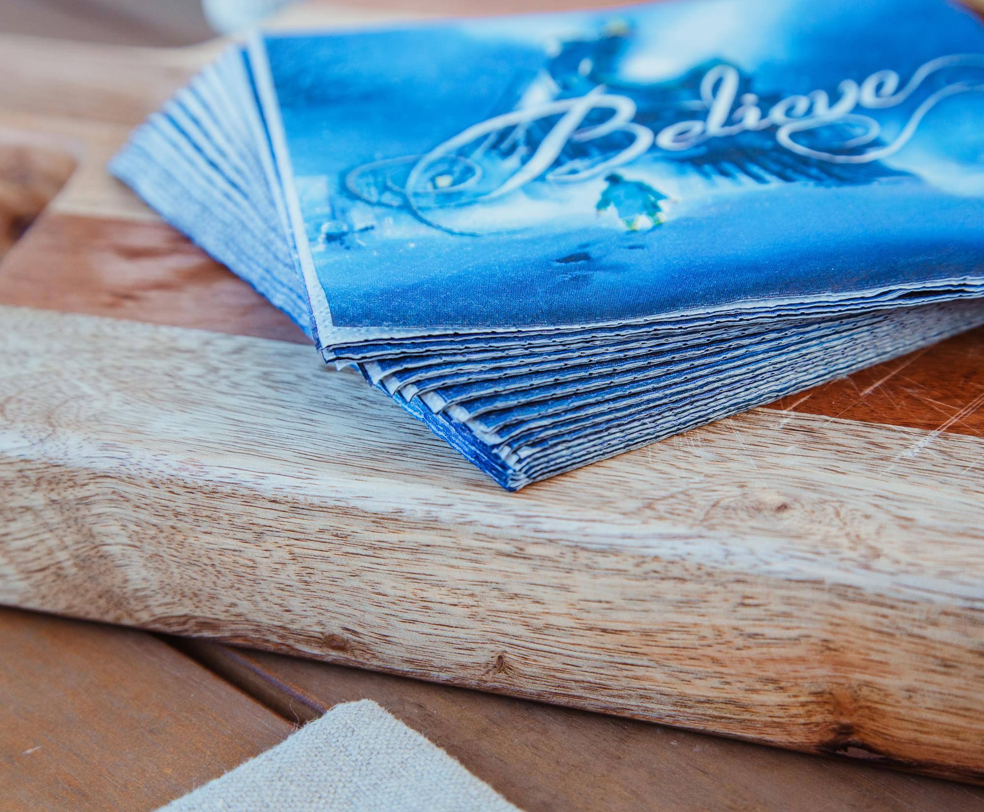 Alt View 3. Silver Buffalo - The Polar Express Train Arrival "Believe" 16-Piece Paper Napkins Set - Blue.