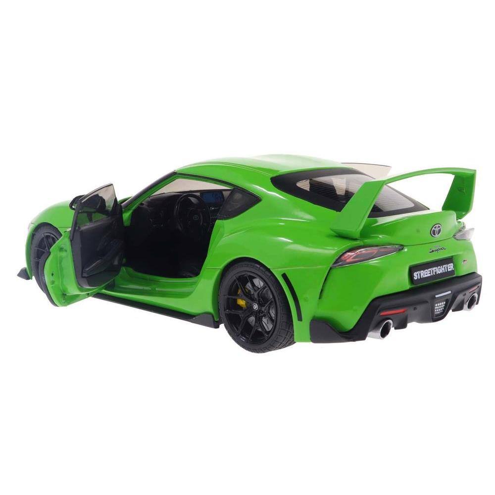Left. Solido - 2023 Toyota GR Supra "StreetFighter" Green 1/18 Diecast Model Car by Solido - Green.